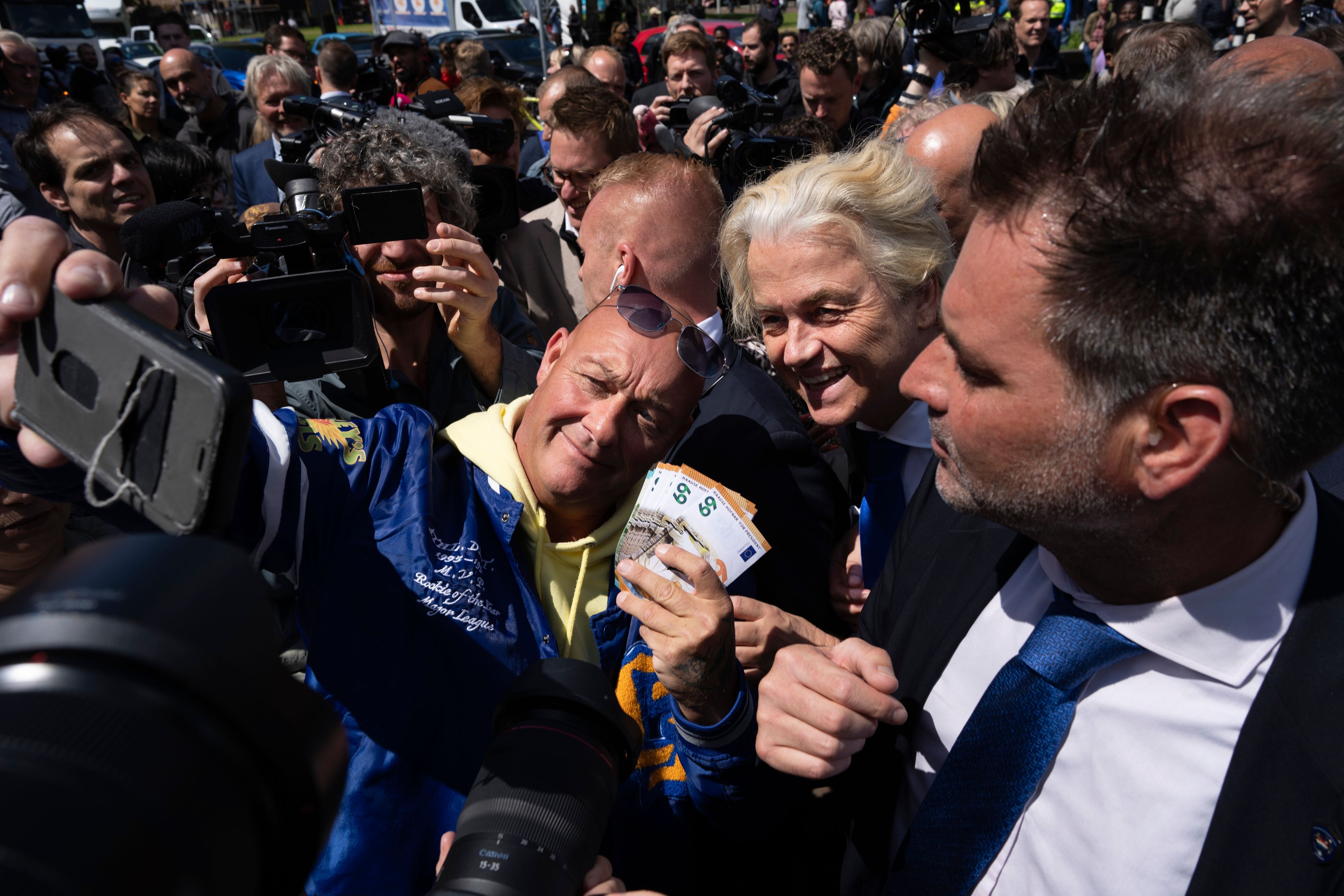 Anti-islam lawmaker Geert Wilders of the PVV, or Party for Freedom, poses for a picture during a campaign stop for the European election at a market in The Hague, the Netherlands, Wednesday, June 5, 2024. Voters in the European Union are set to elect lawmakers starting Thursday June 6th for the bloc's parliament.