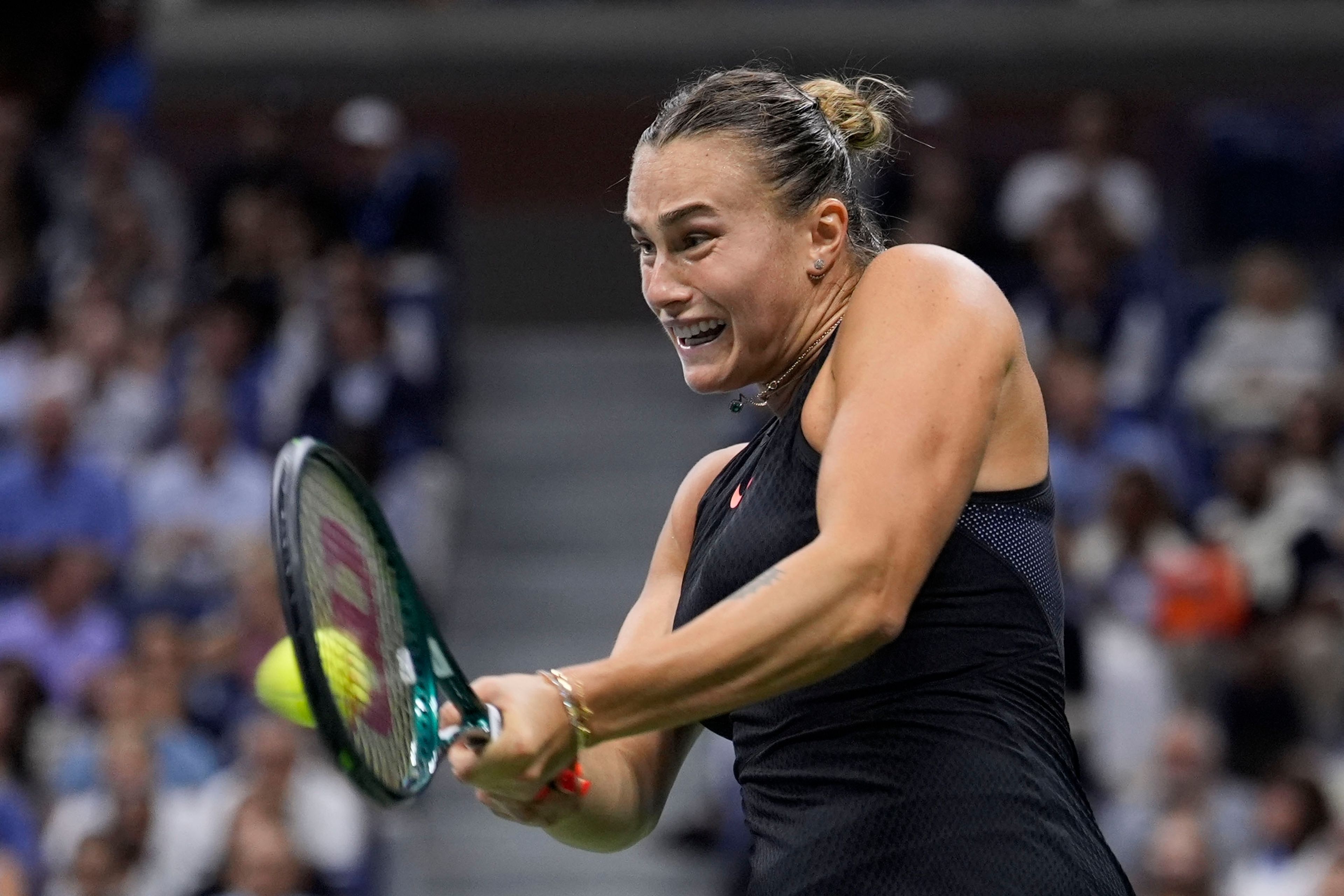 Aryna Sabalenka, of Belarus, returns a shot to Emma Navarro, of the United States, during the women's singles semifinals of the U.S. Open tennis championships, Thursday, Sept. 5, 2024, in New York.