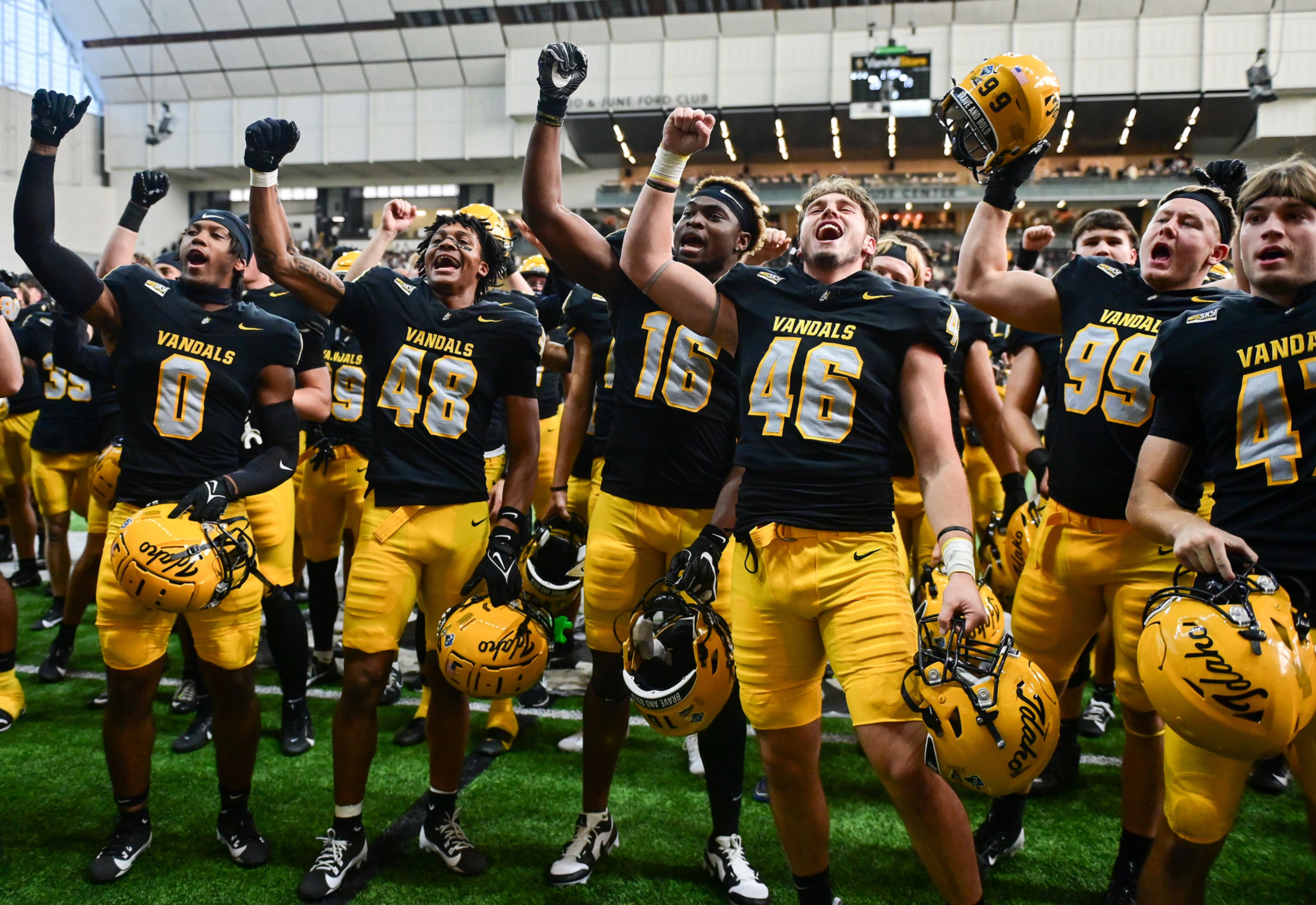 Idaho players chant along to a fight song after their homecoming weekend victory over Northern Arizona Saturday at the P1FCU Kibbie Dome in Moscow.,