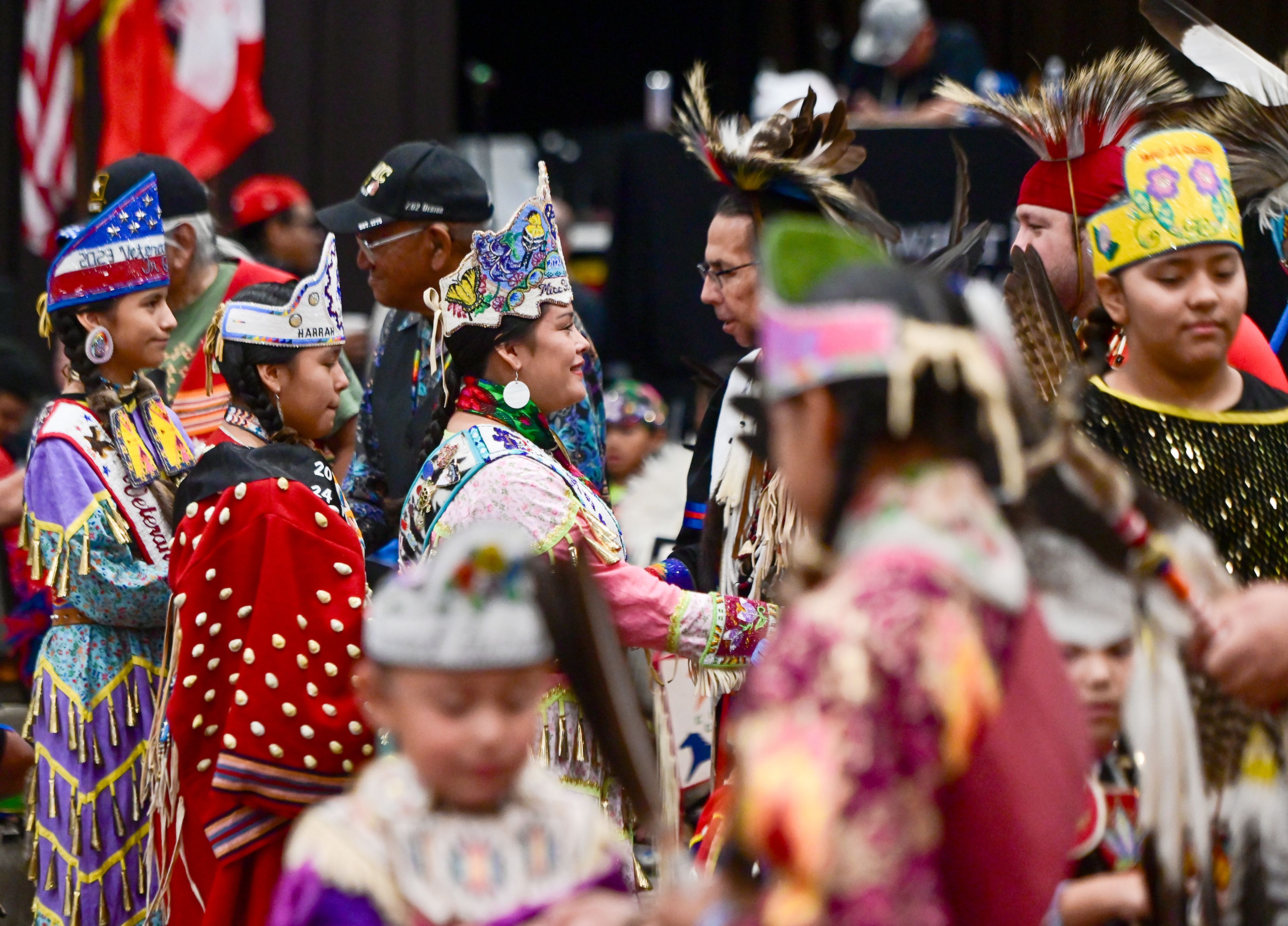 Dancers and leaders shake hands after a Grand Entry as part of the Hiitem'waq'iswit Dance for Life Powwows Saturday events at the Clearwater River Casino & Lodge arena in Lewiston last weekend.,