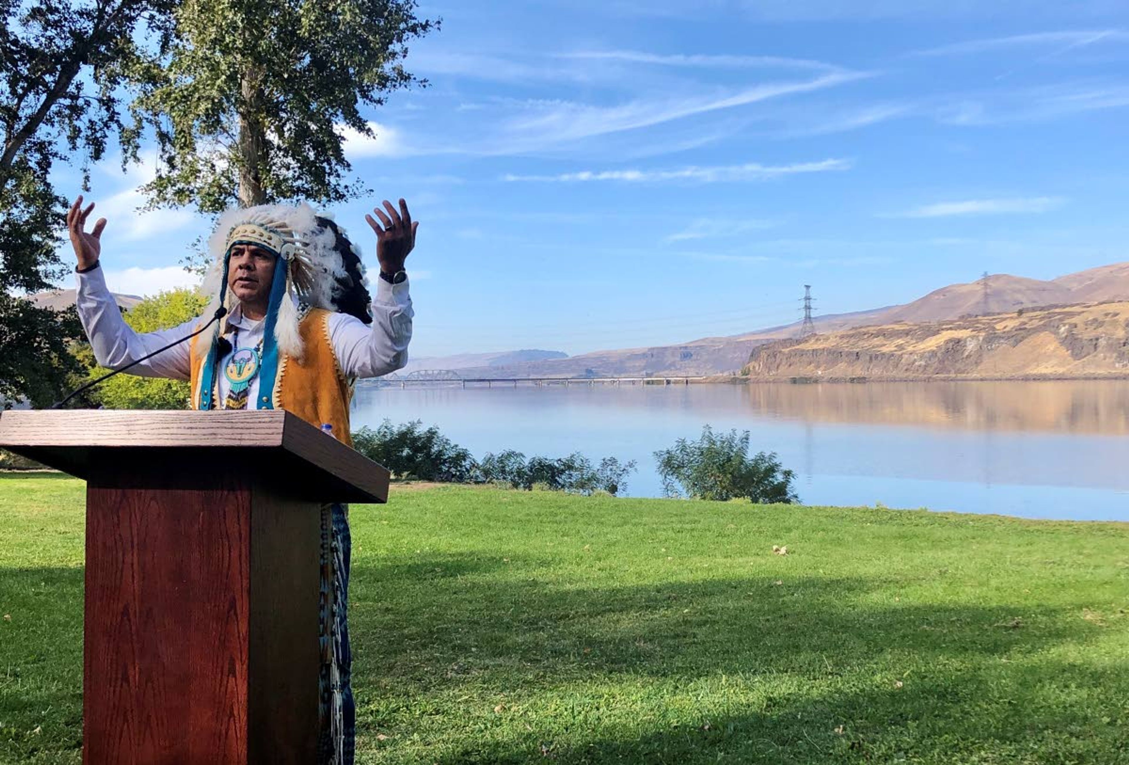 JoDe Goudy, chairman of the Yakama Nation, speaks with the Columbia River in the background near The Dalles, Ore., on Monday, where Celilo Falls, an ancient salmon fishing site was destroyed by the construction of The Dalles Dam in the 1950s.