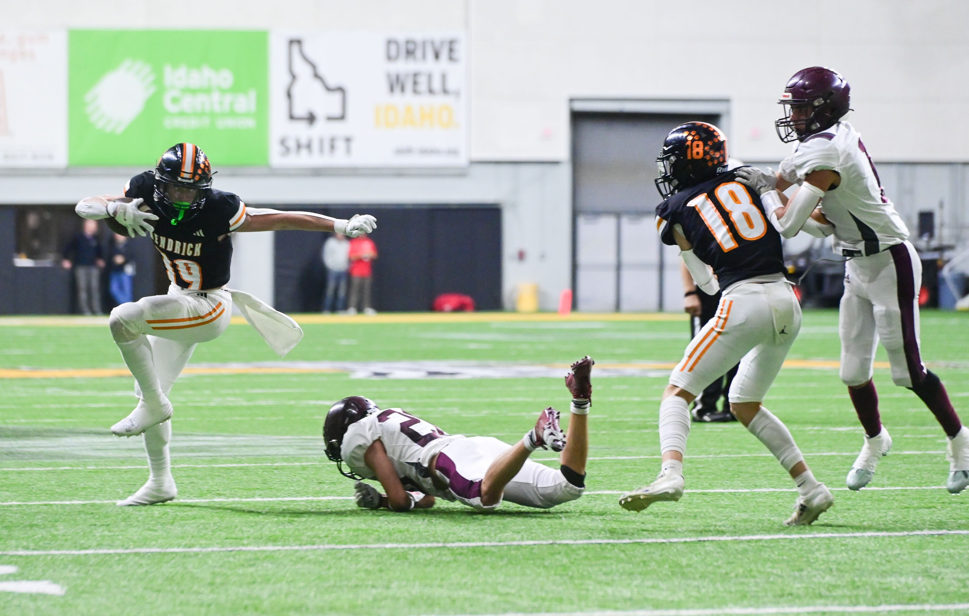 Kendrick’s Sawyer Hewett dodges a tackle attempt by Kamiah’s Matthew Oatman during an Idaho Class 2A state quarterfinal game at the P1FCU Kibbie Dome in Moscow.