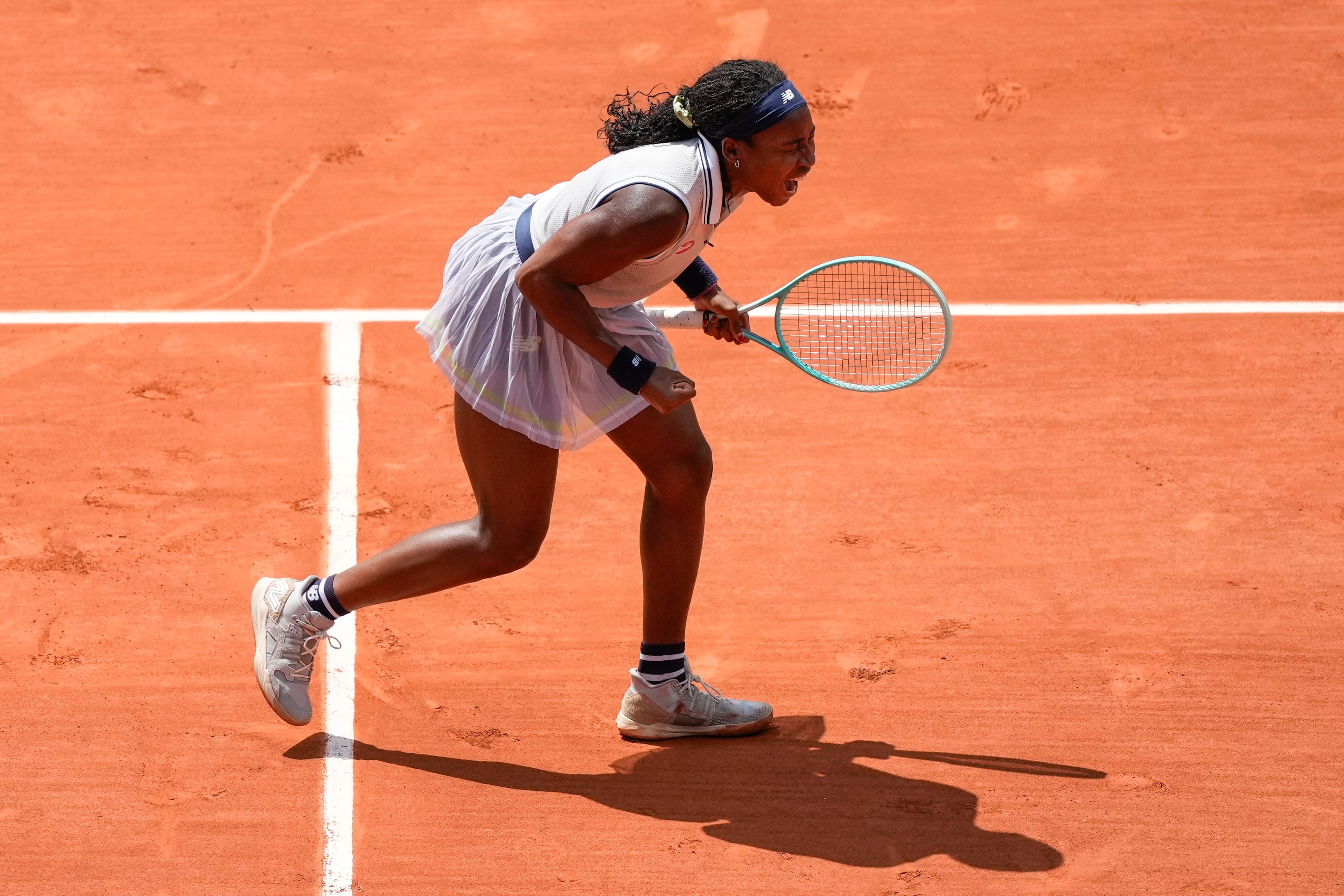 Coco Gauff of the U.S. celebrates winning her quarterfinal match of the French Open tennis tournament against Tunisia's Ons Jabeur at the Roland Garros stadium in Paris, Tuesday, June 4, 2024.