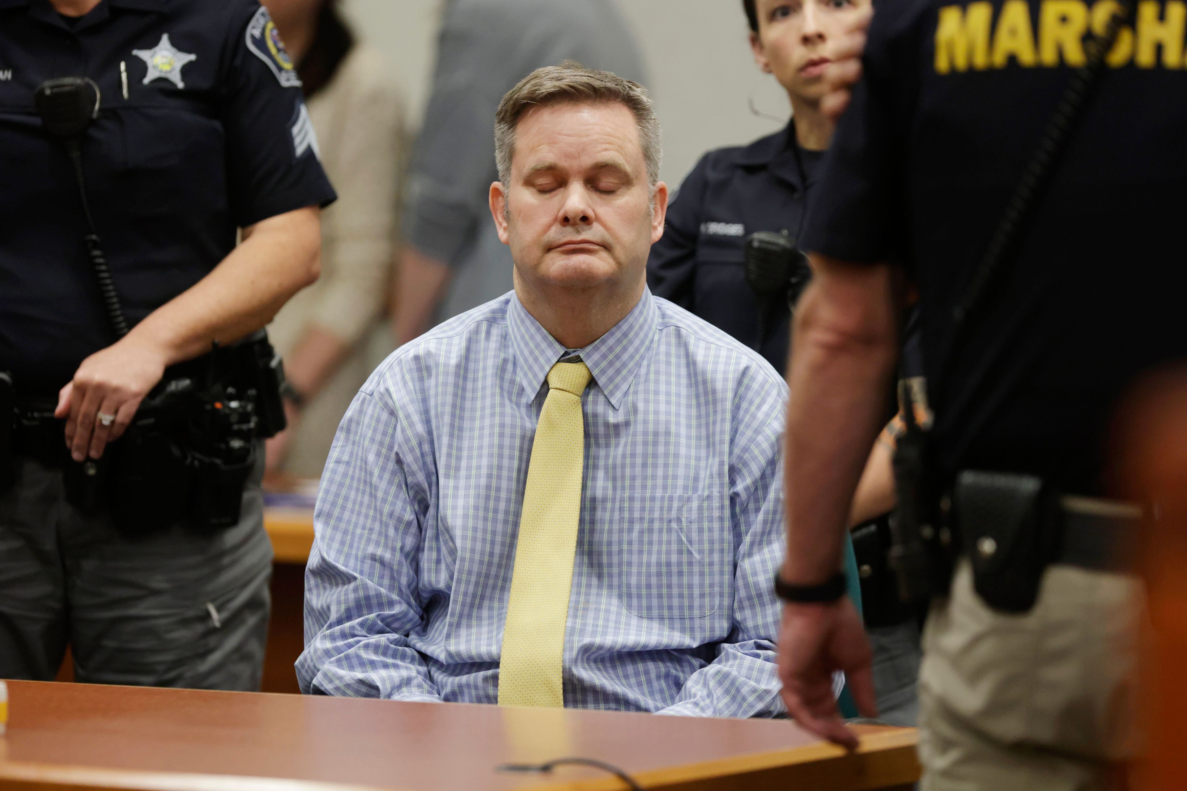 Chad Daybell sits and closes his eyes after the jury's verdict in his murder trial was read at the Ada County Courthouse in Boise, Idaho, on Thursday, May 30, 2024. Daybell was convicted of killing his wife and his new girlfriend's two youngest kids in a strange triple murder case that included claims of apocalyptic prophesies, zombie children and illicit affairs. (AP Photo/Kyle Green, Pool)