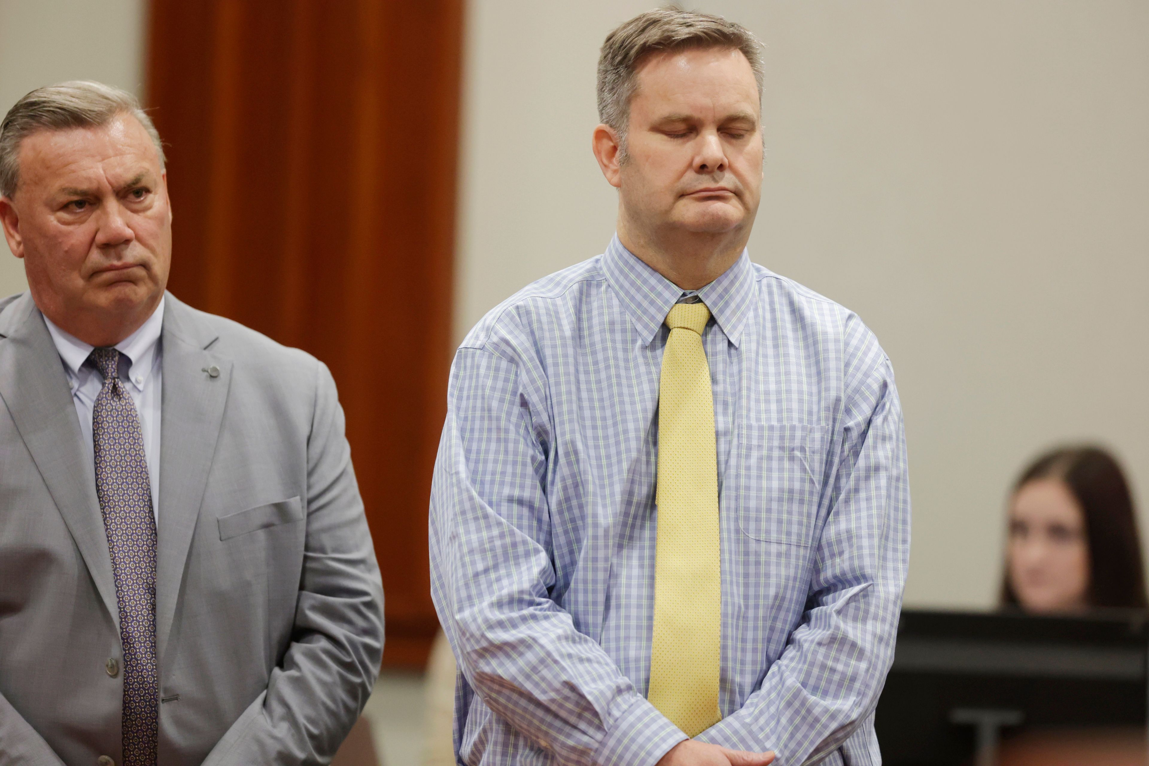 Chad Daybell, right, stands with defense lawyer John Prior after the jury's verdict in his murder trial is read at the Ada County Courthouse in Boise, Idaho, on Thursday, May 30, 2024. Daybell was convicted of killing his wife and his new girlfriend's two youngest kids in a strange triple murder case that included claims of apocalyptic prophesies, zombie children and illicit affairs. (AP Photo/Kyle Green, Pool)