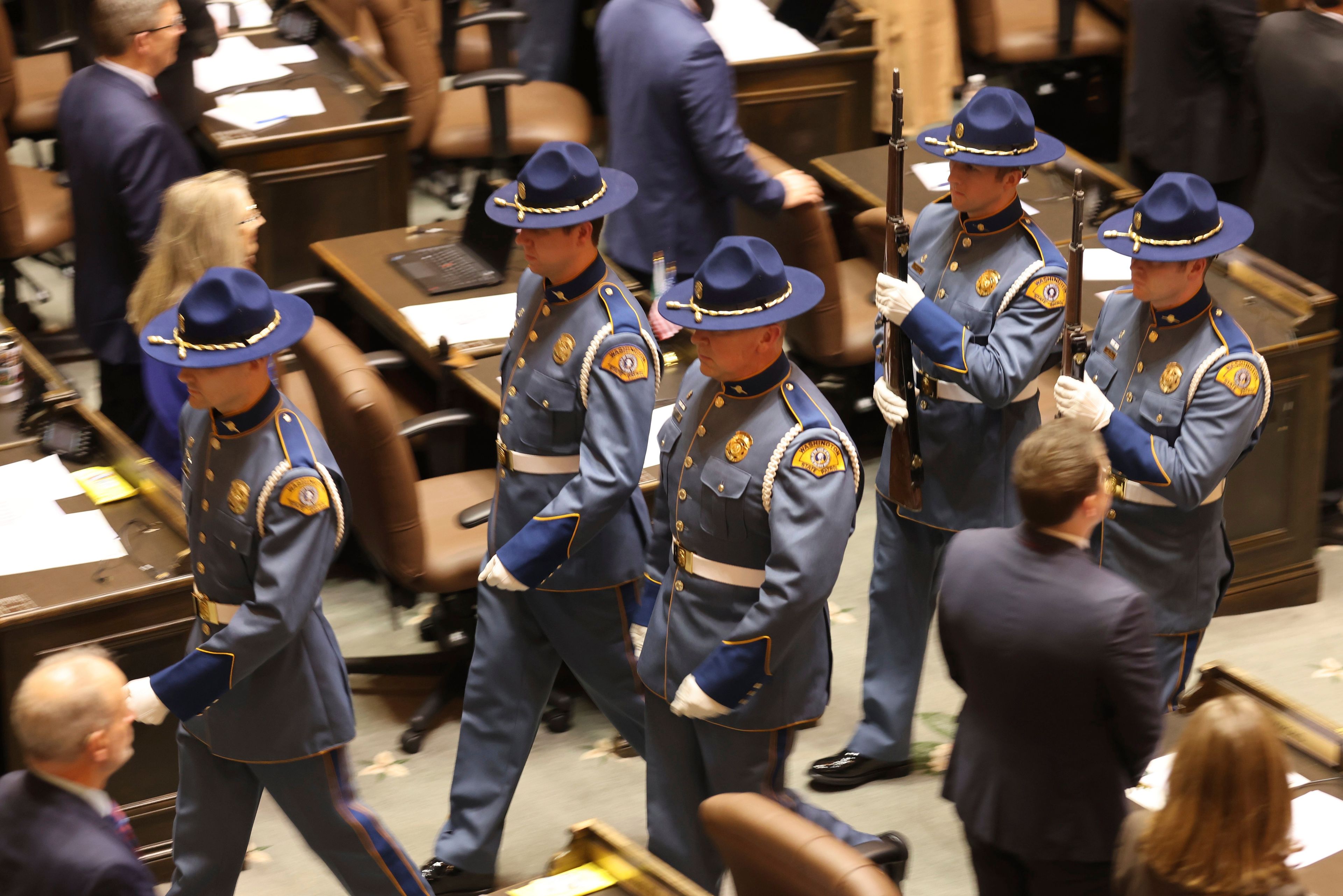 Members of the Washington State Honor Guard present the Colors during the first day of the legislative session at the Washington state Capitol in Olympia, Wash., on Monday, Jan. 9, 2023. (Karen Ducey/The Seattle Times via AP)