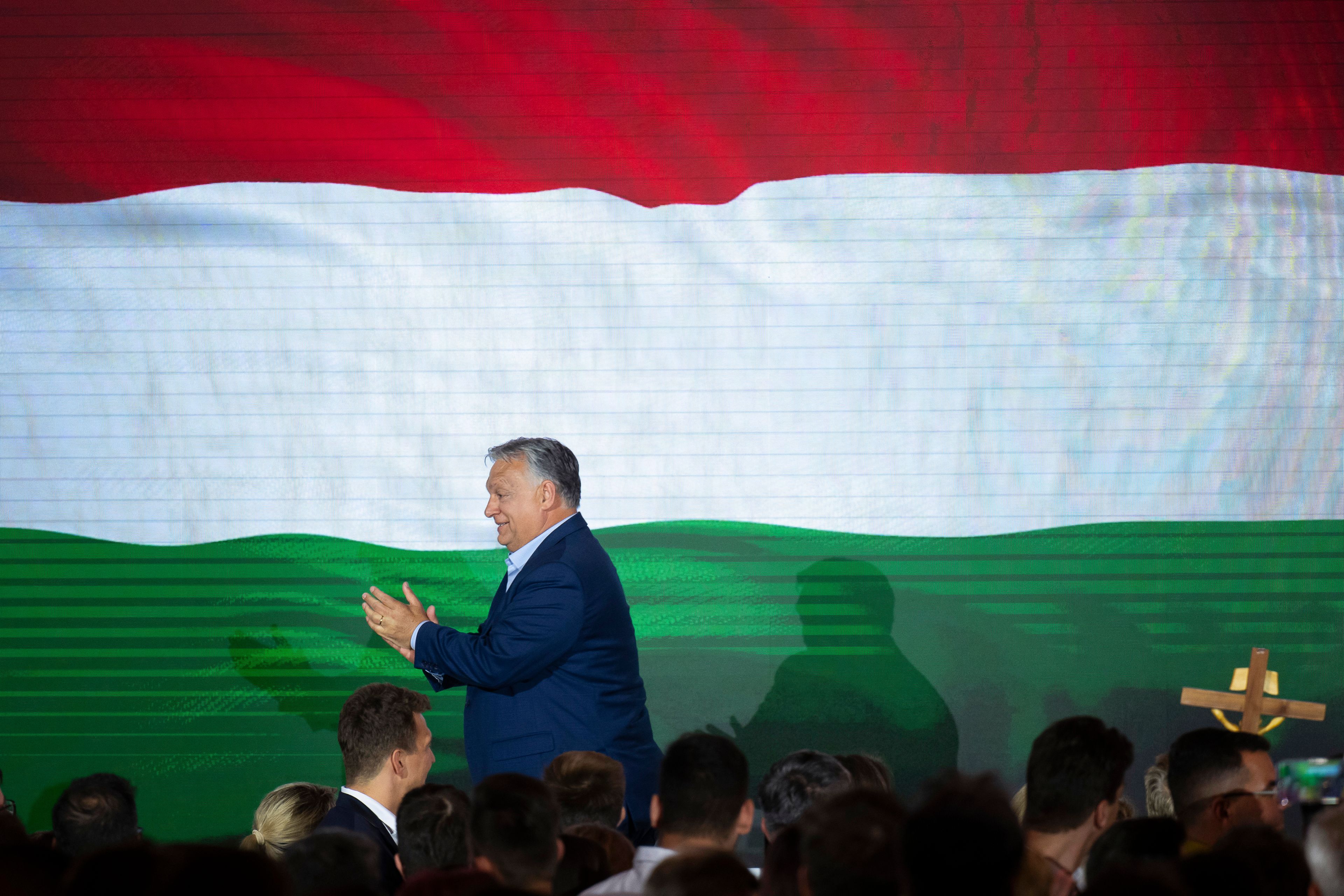 Hungarian Prime Minister Viktor Orban claps after addressing the media after receiving the results of the European Parliamentary elections in Budapest, Hungary, Monday, June 10, 2024.