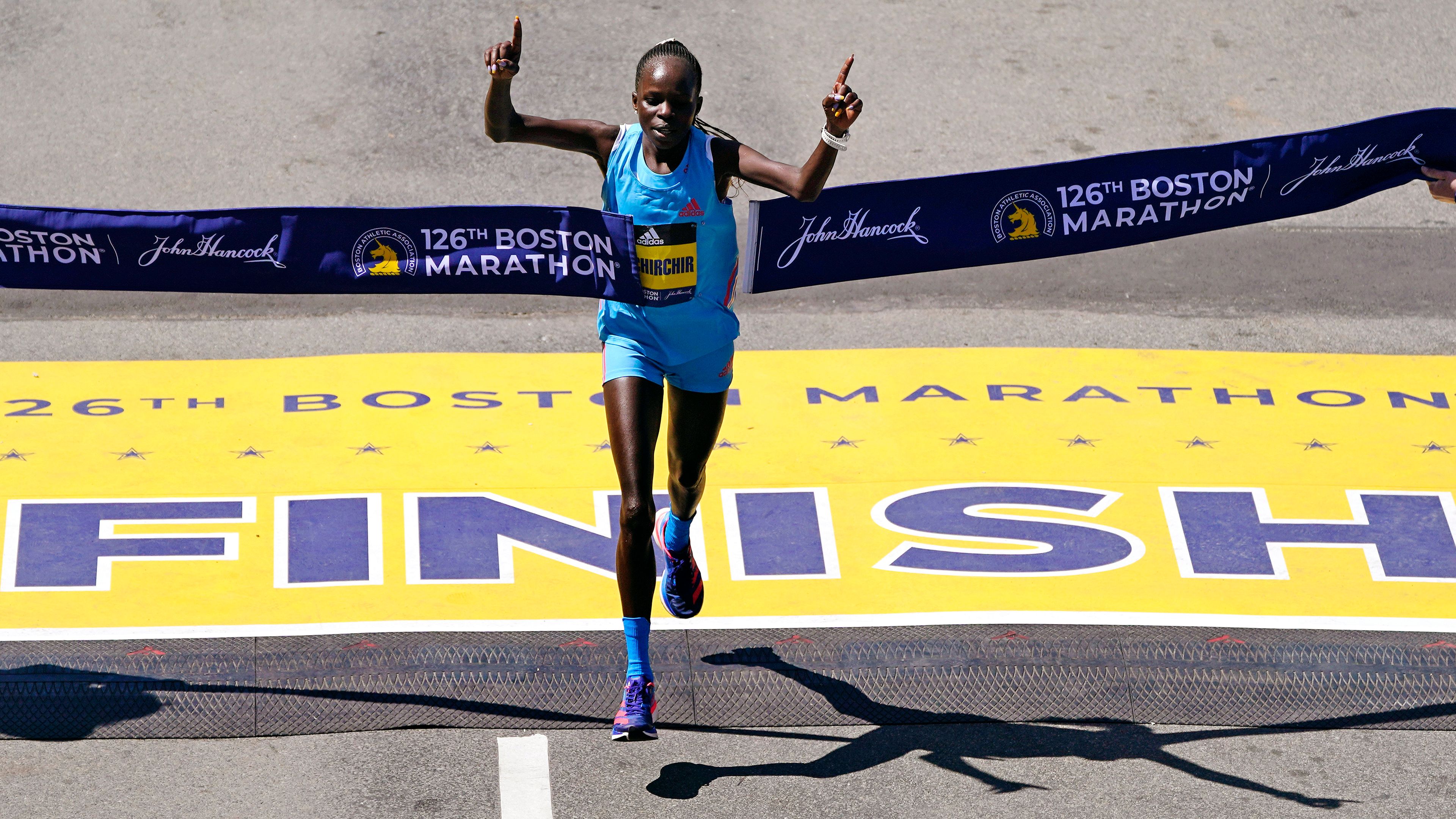 Peres Jepchirchir, of Kenya, breaks the tape to win the women's division of the Boston Marathon, Monday, April 18, 2022, in Boston. (AP Photo/Charles Krupa)