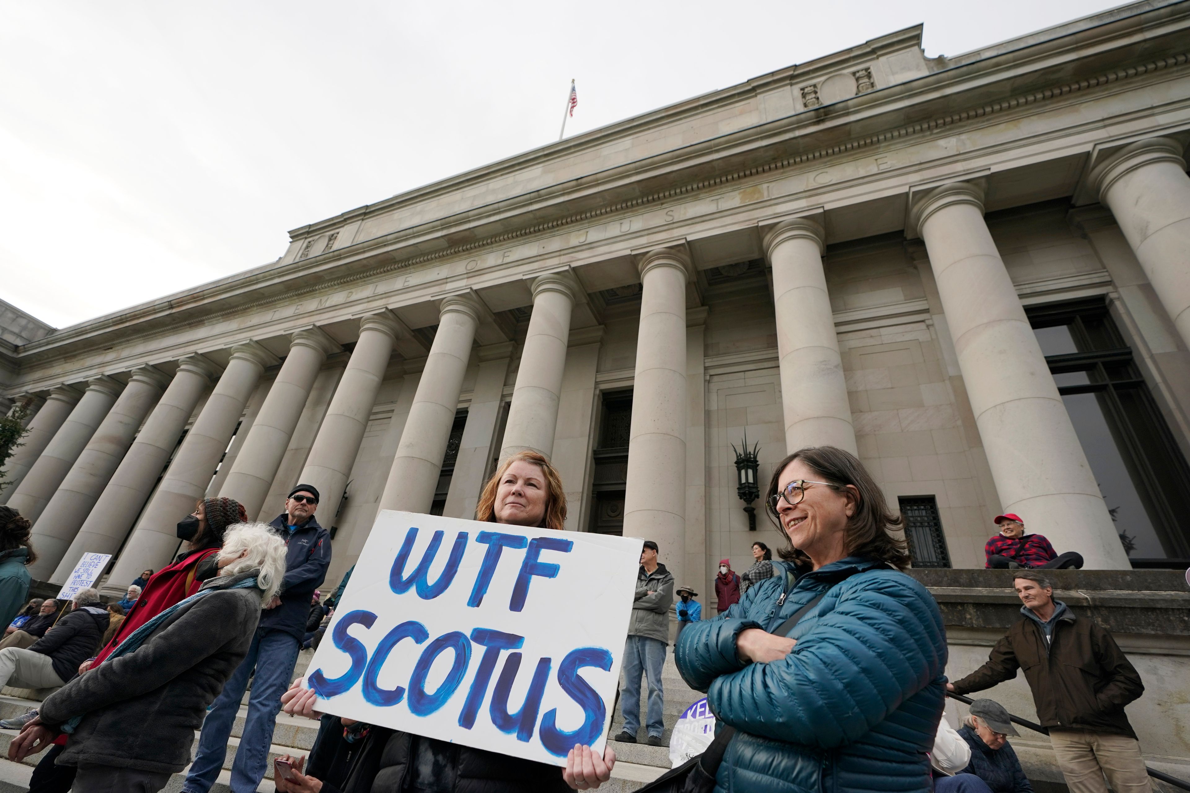 A person holds a sign referencing the U.S. Supreme Court as they take part in a rally in favor of abortion rights on the steps of the Temple of Justice, which houses the Washington state Supreme Court, Tuesday, May 3, 2022, at the Capitol in Olympia, Wash. (AP Photo/Ted S. Warren)