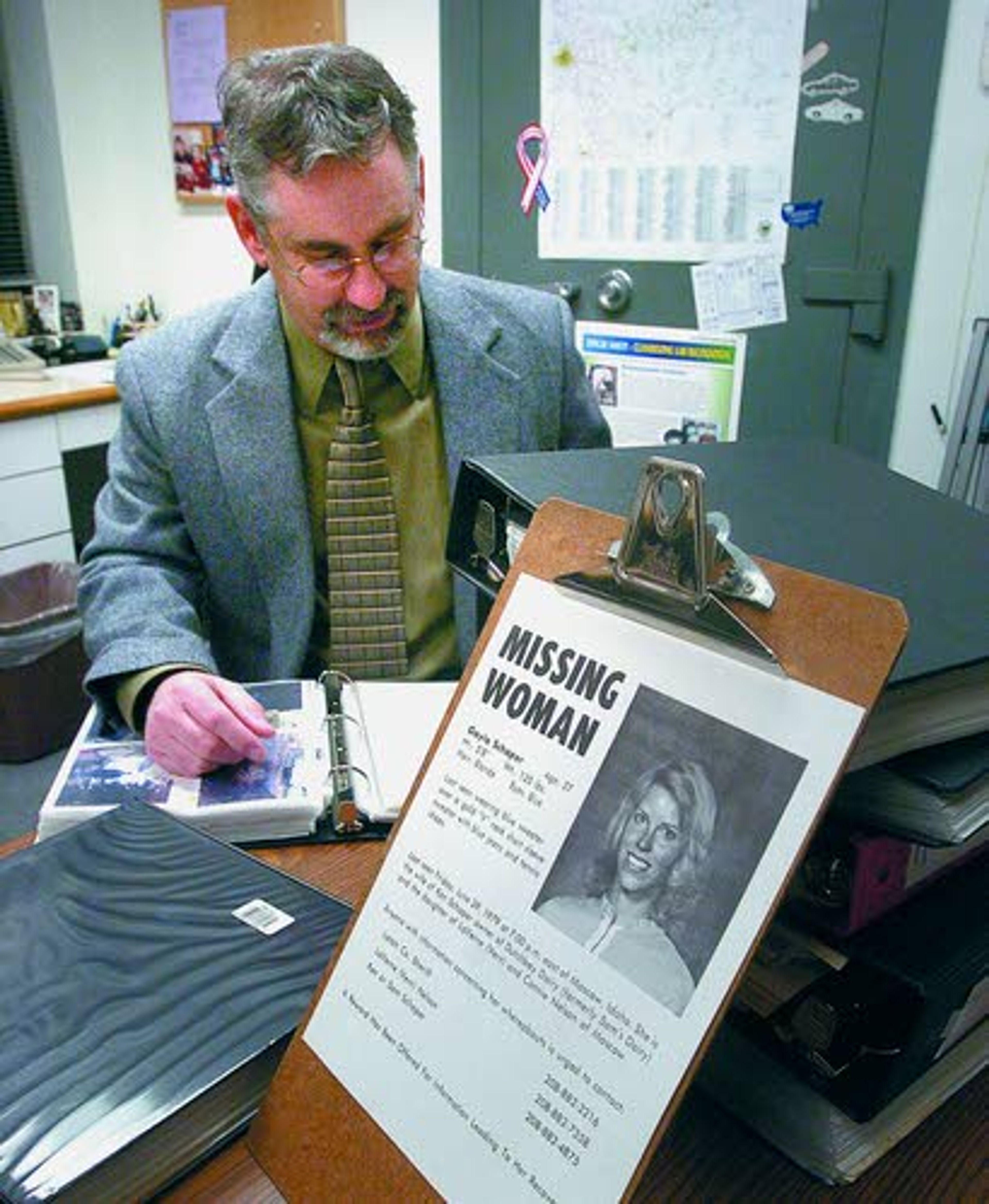 Tribune/Steve HanksSgt. Brannon Jordan looks over the extensive case files at the Latah County Sheriff’s Office has for the Gayla Schaper missing persons case.