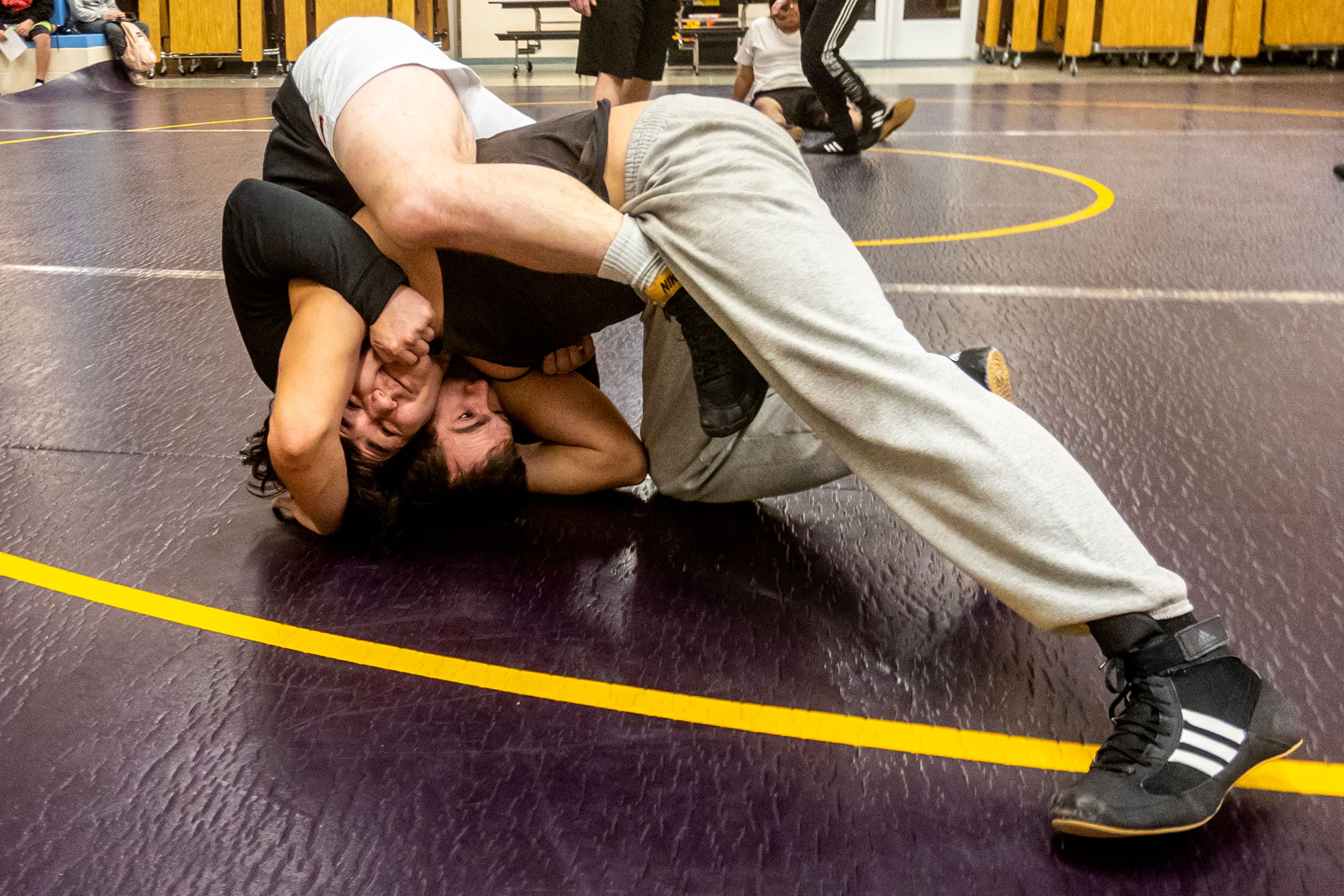 Layson Morrell tries to shake off Lapwai wrestling coach Chris Katus during a Jan. 11 practice. The Wildcats started the season with three wrestlers and now have seven.