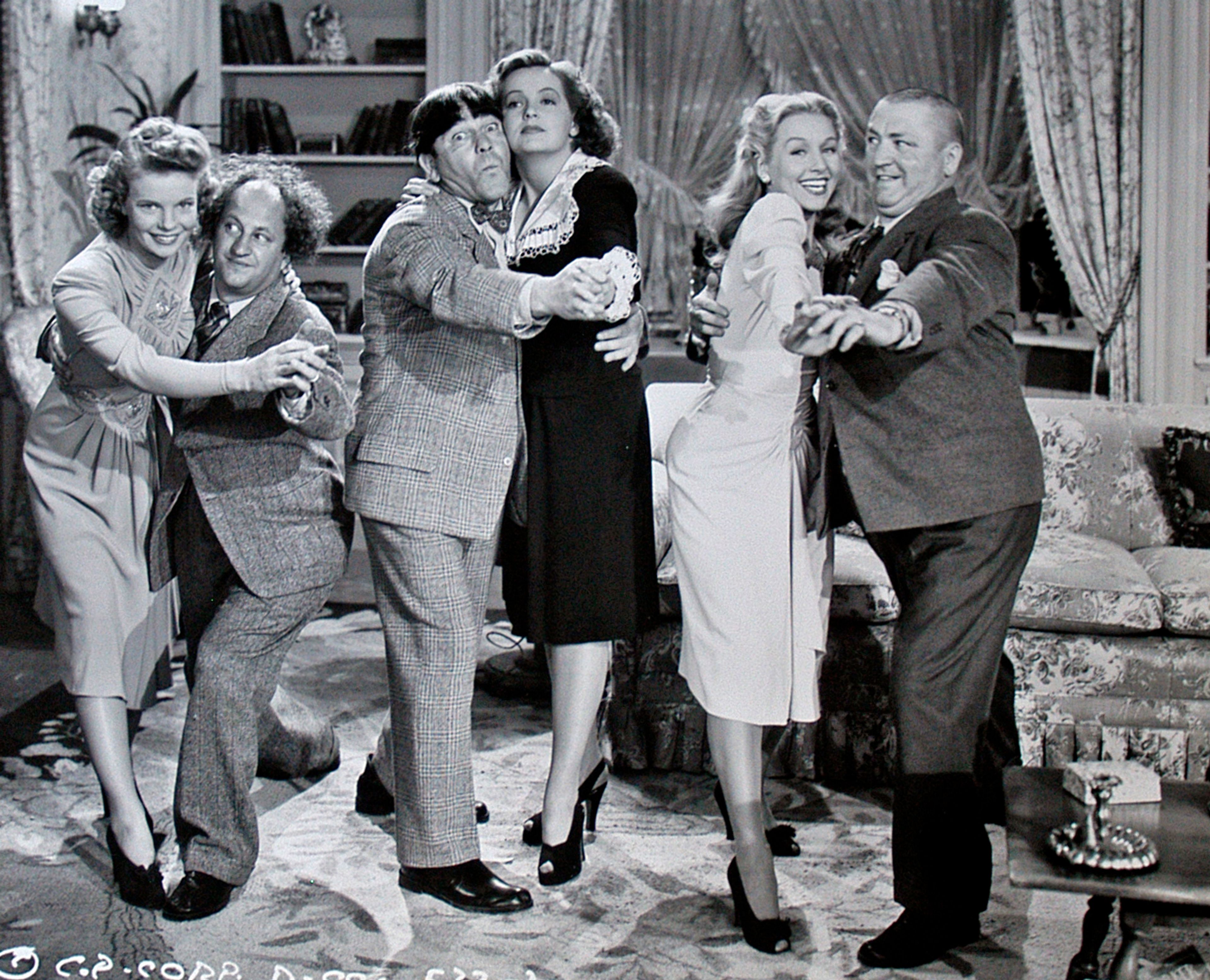 In the Three Stooges feature "Three Smart Saps" of 1942, Julie Gibson dances with Curly Howard, at right.