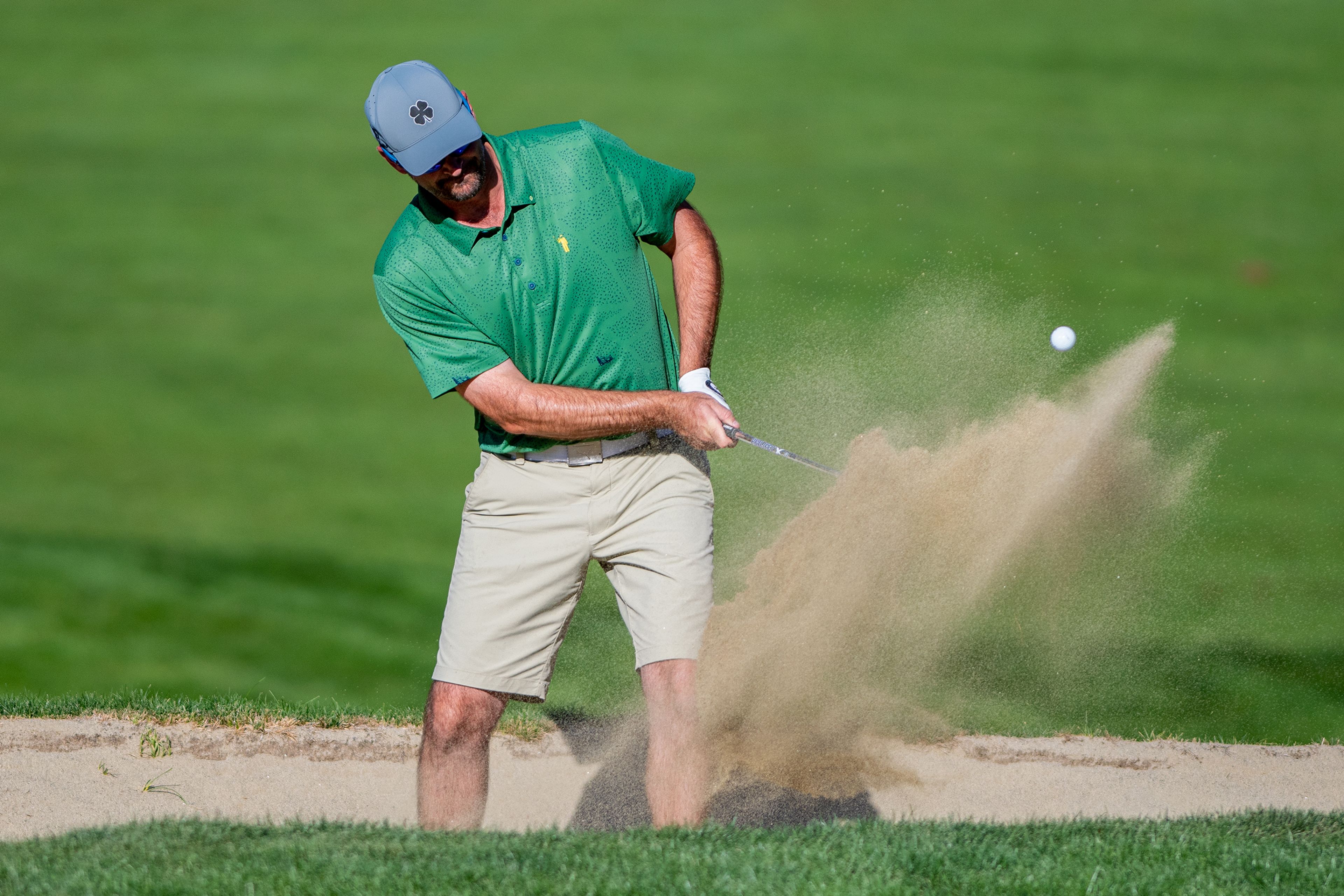 Corey Brown chips out of sand trap on the 16th hole during the 2022 Sole Survivor golf tournament at the Lewiston Golf and Country Club on Monday.