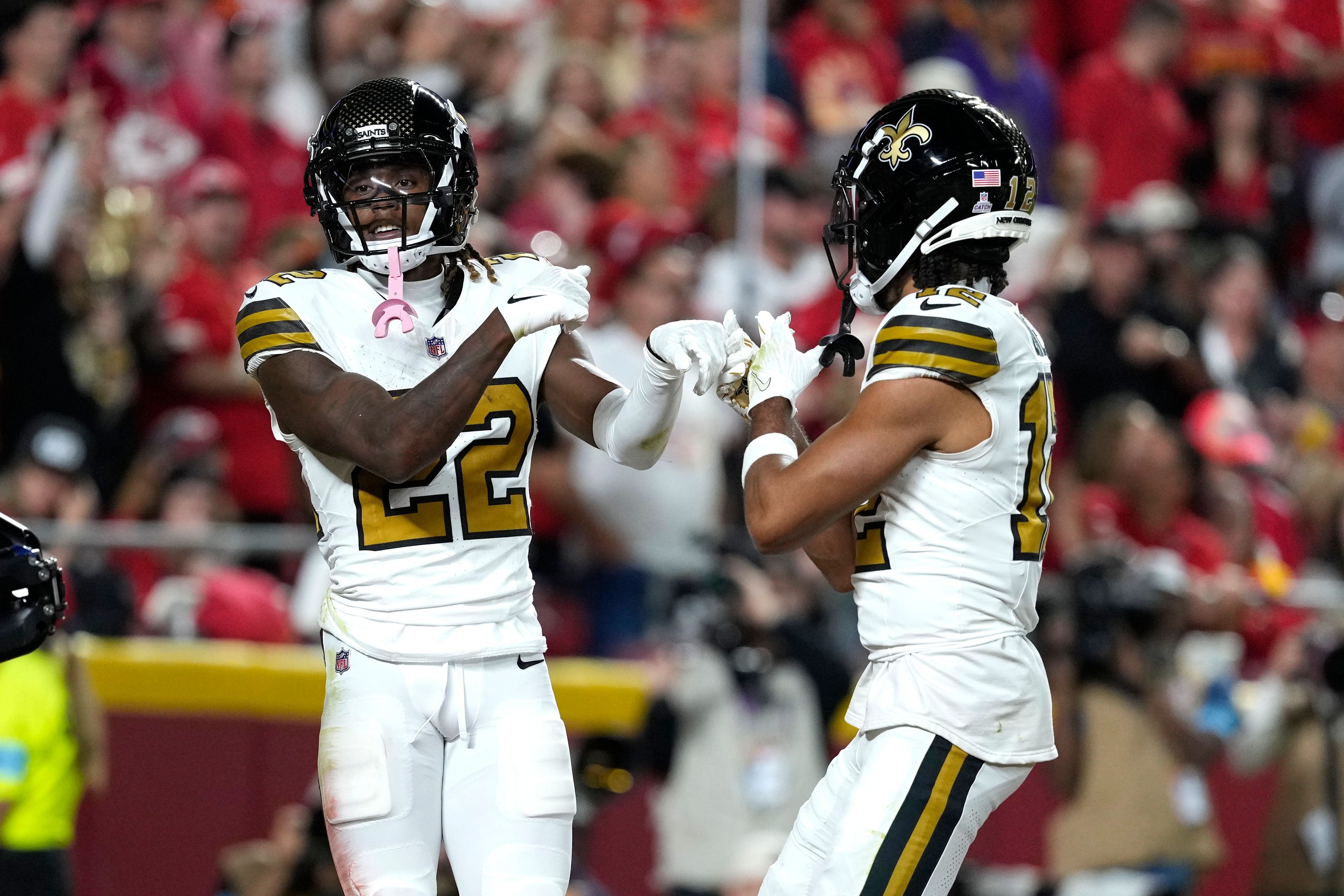 New Orleans Saints Rashid Shaheed, left, is congratulated by wide receiver Chris Olave after scoring during the first half of an NFL football game against the Kansas City Chiefs Monday, Oct. 7, 2024, in Kansas City, Mo. (AP Photo/Ed Zurga)