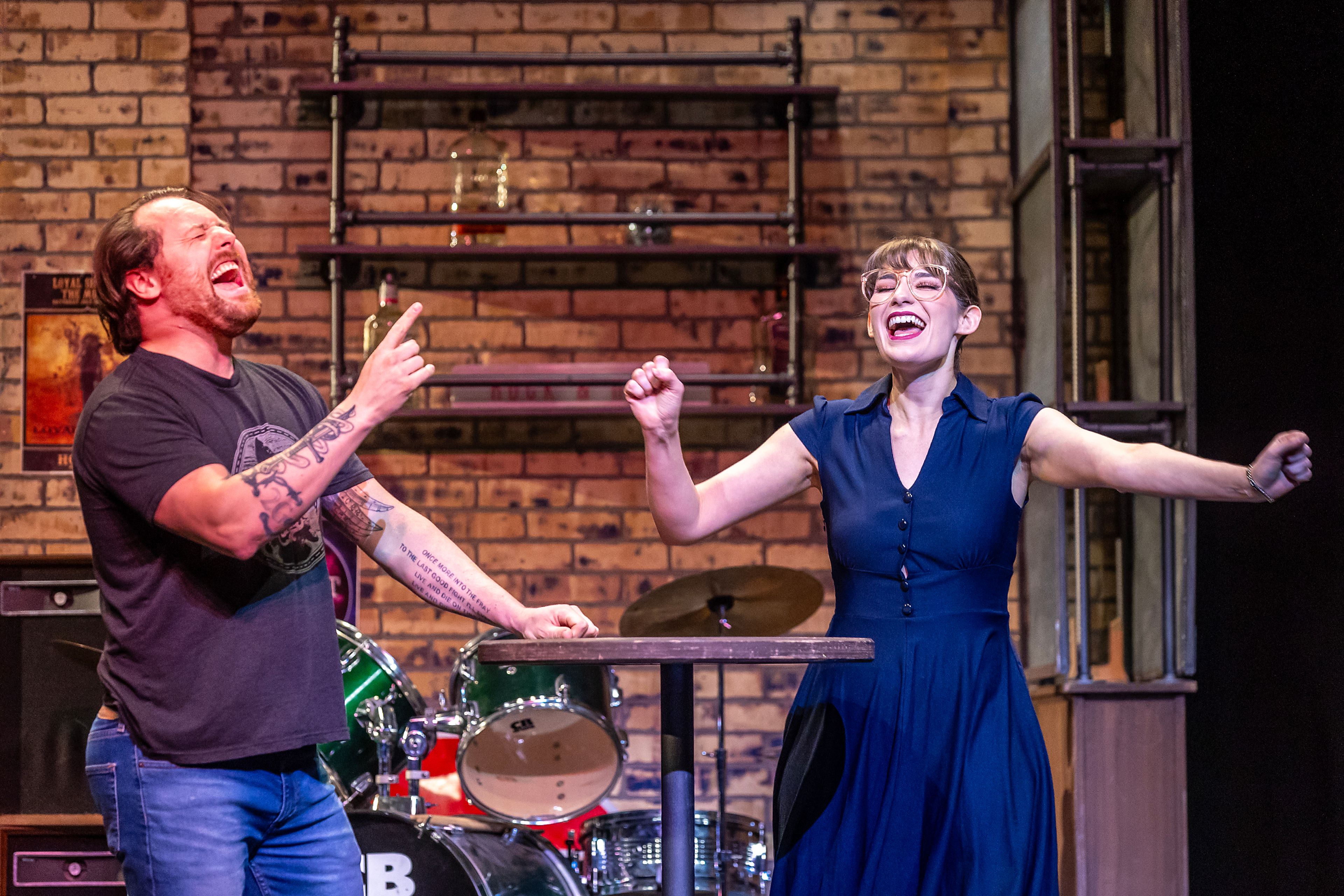 TJ Richardson, left, plays Dewey Finn, as Monica Evans plays Rosalie Mullins in the rockstar cast during a rehearsal for the Civic Theatre production of School of Rock Tuesday, May 21, in Lewiston.