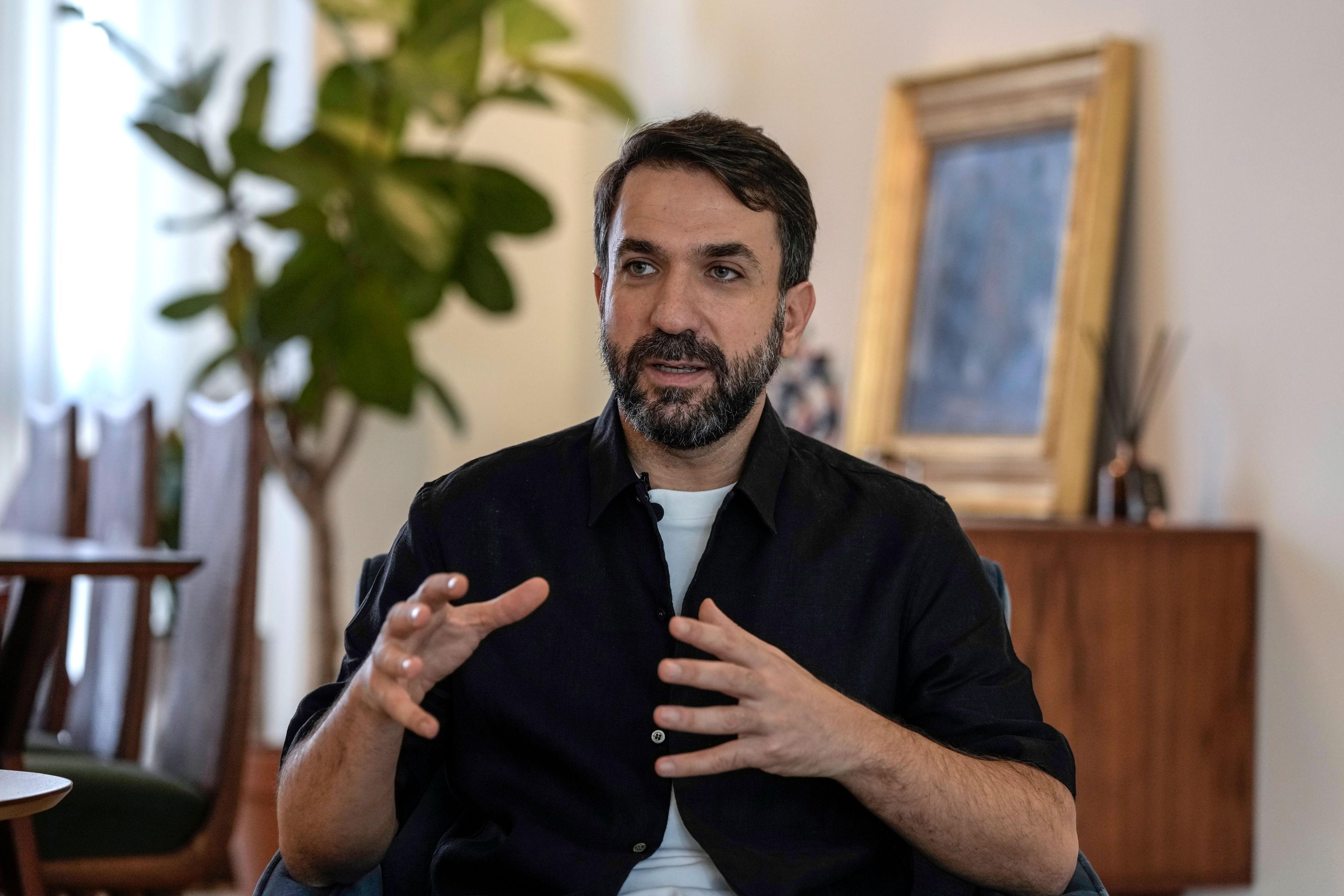 Lubnan Baalbaki speaks during an interview with The Associated Press at his house in Geitawi, Beirut, Lebanon, Thursday, Oct. 31, 2024. (AP Photo/Bilal Hussein)