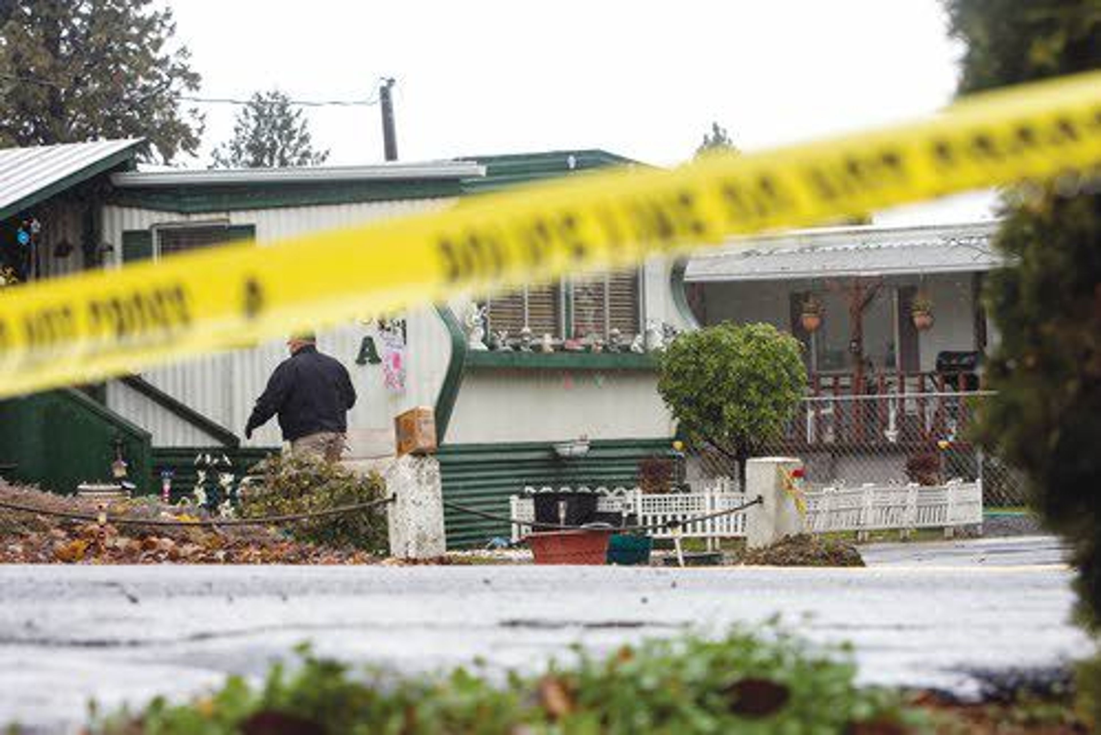 Police tape restricts access to the entrance of a mobile home park on the 600 block of Preston as investigators from the Lewiston Police Department search a pair of adjacent homes for clues in a double homicide Tuesday morning in Lewiston.