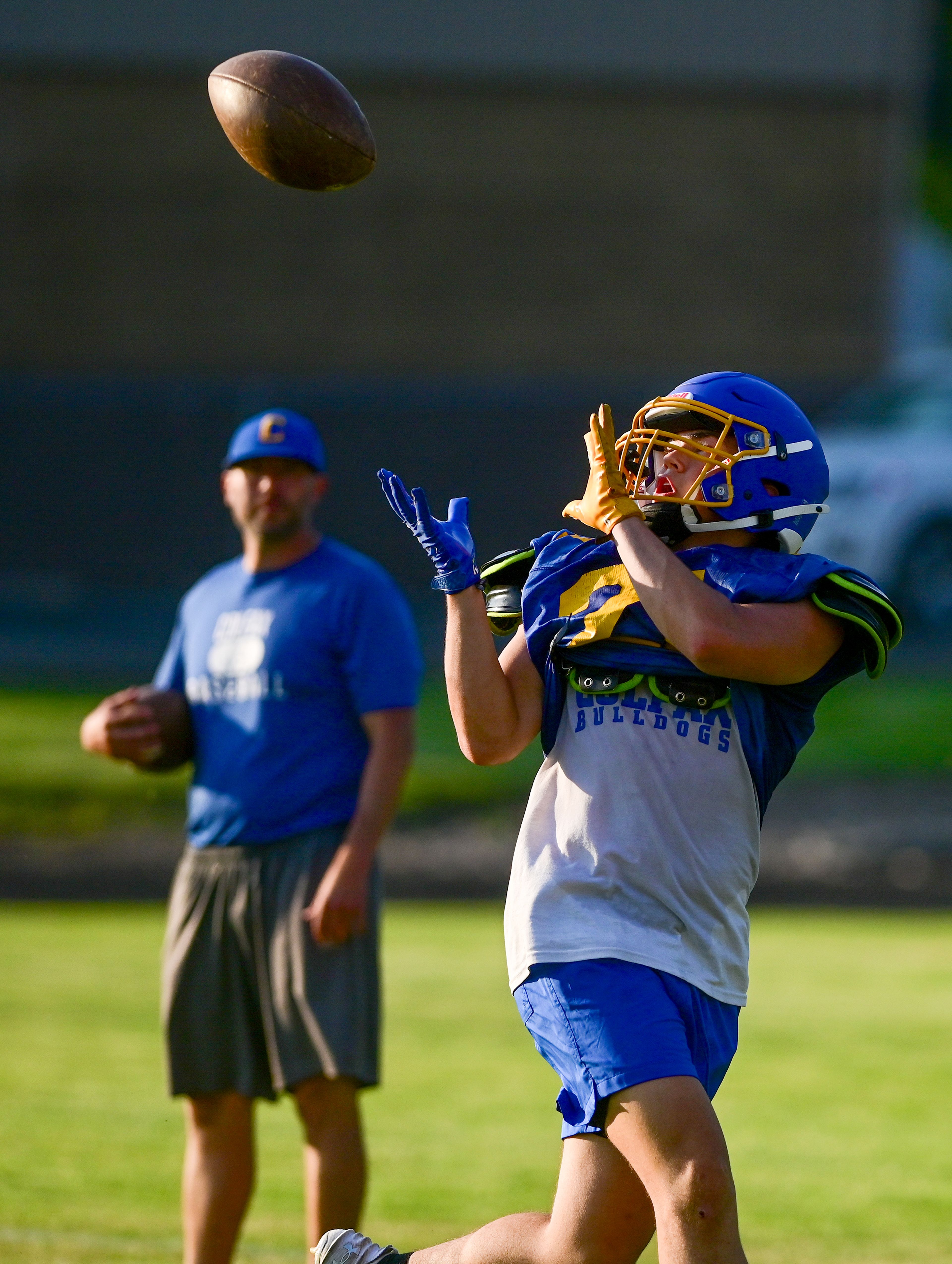 Colfax runs through plays at practice on Tuesday.