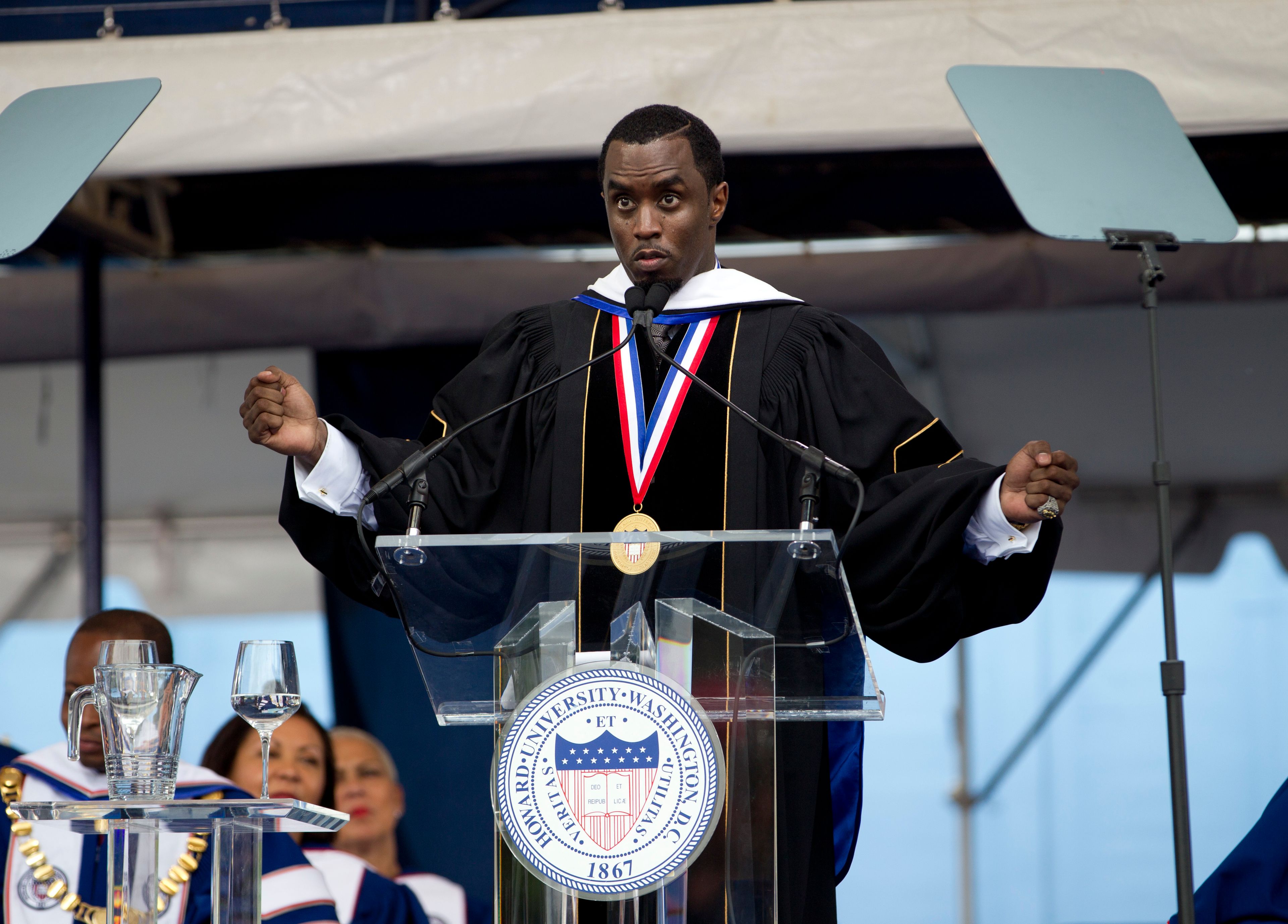 FILE - Entertainer and entrepreneur Sean "Diddy" Combs delivers Howard University's commencement speech during the 2014 graduation ceremony in Washington, Saturday, May 10, 2014. In a decision, Friday, June 7, 2024, Howard University is cutting ties to Combs, rescinding an honorary degree that was awarded to him and disbanding a scholarship program in his name.