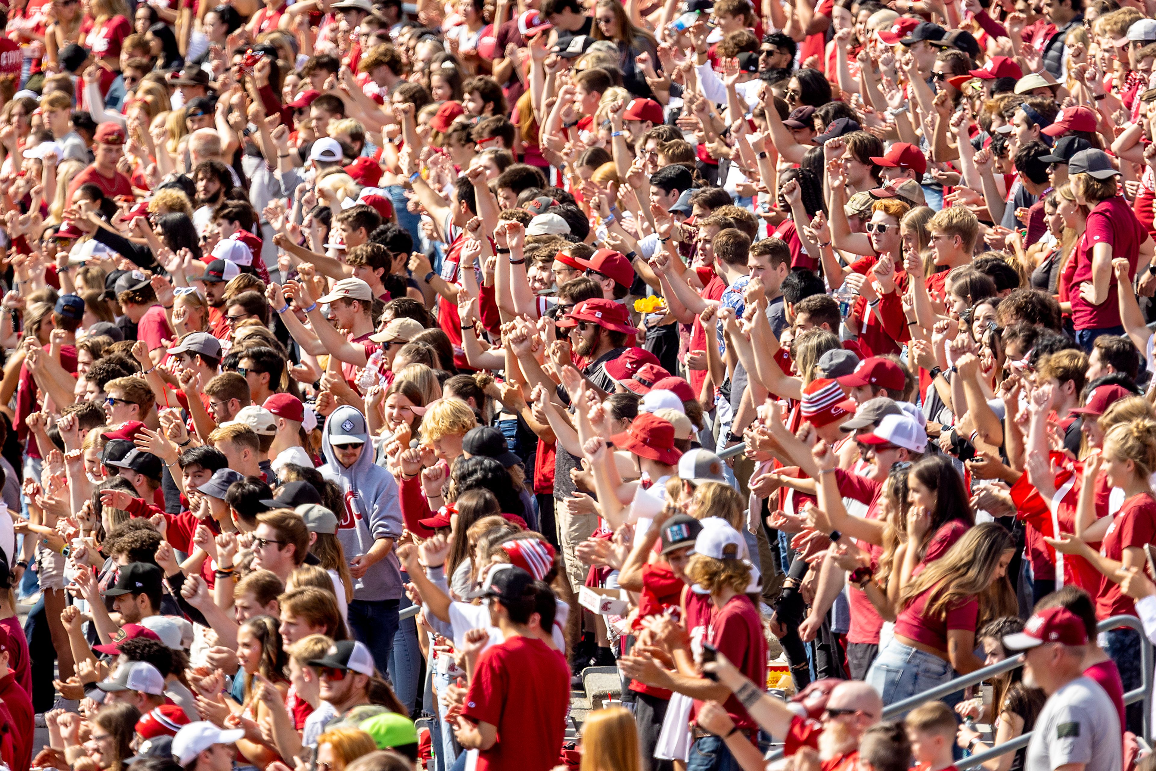 The Washington State student section sings along to the WSU fight song before a nonconforance football game on Saturday at Martin Stadium in Pullman.