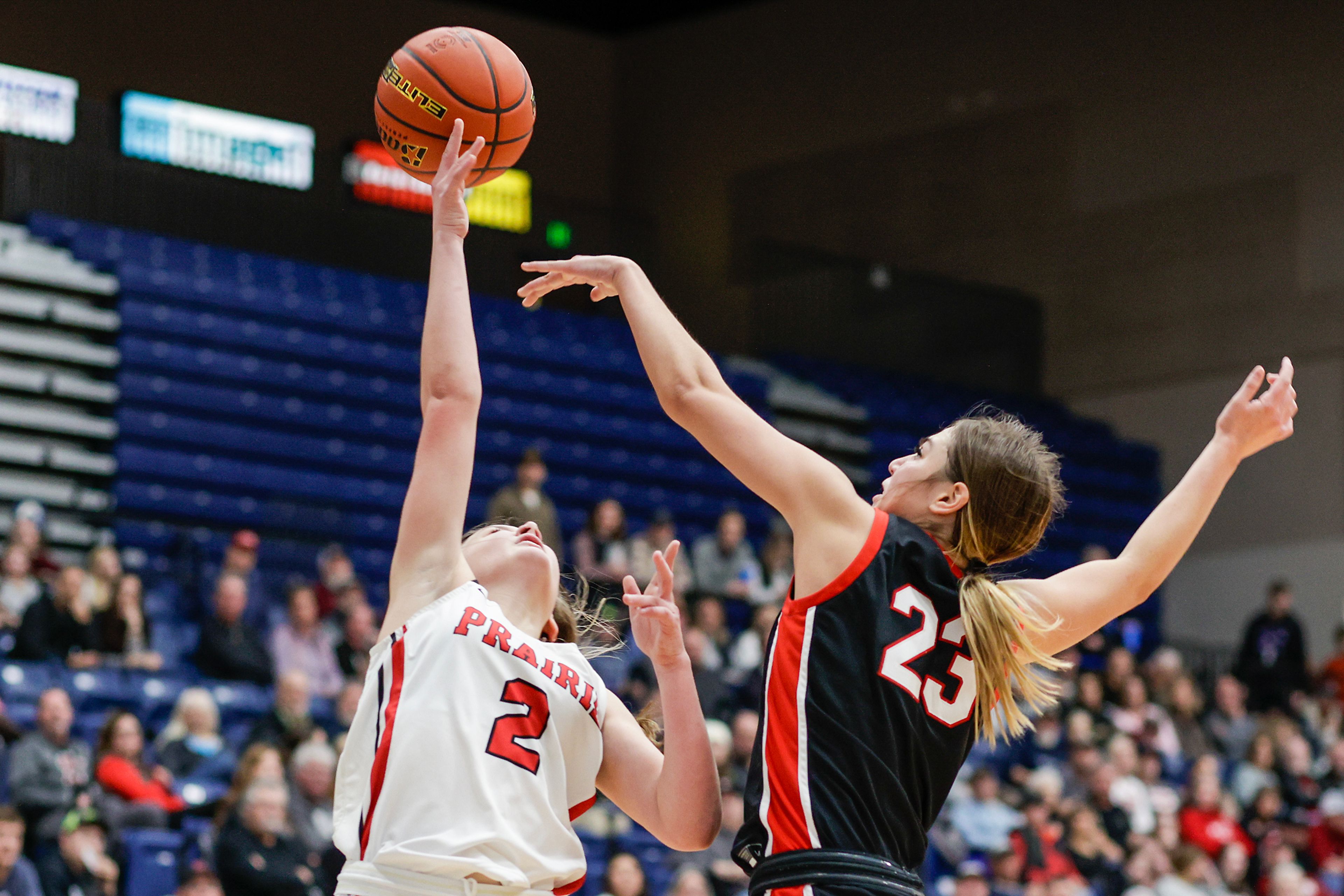 Clarkston wing Alahondra Perez blocks the shot of Prairie guard Lexi Schumacher during the Avista Holiday Tournament on Wednesday.