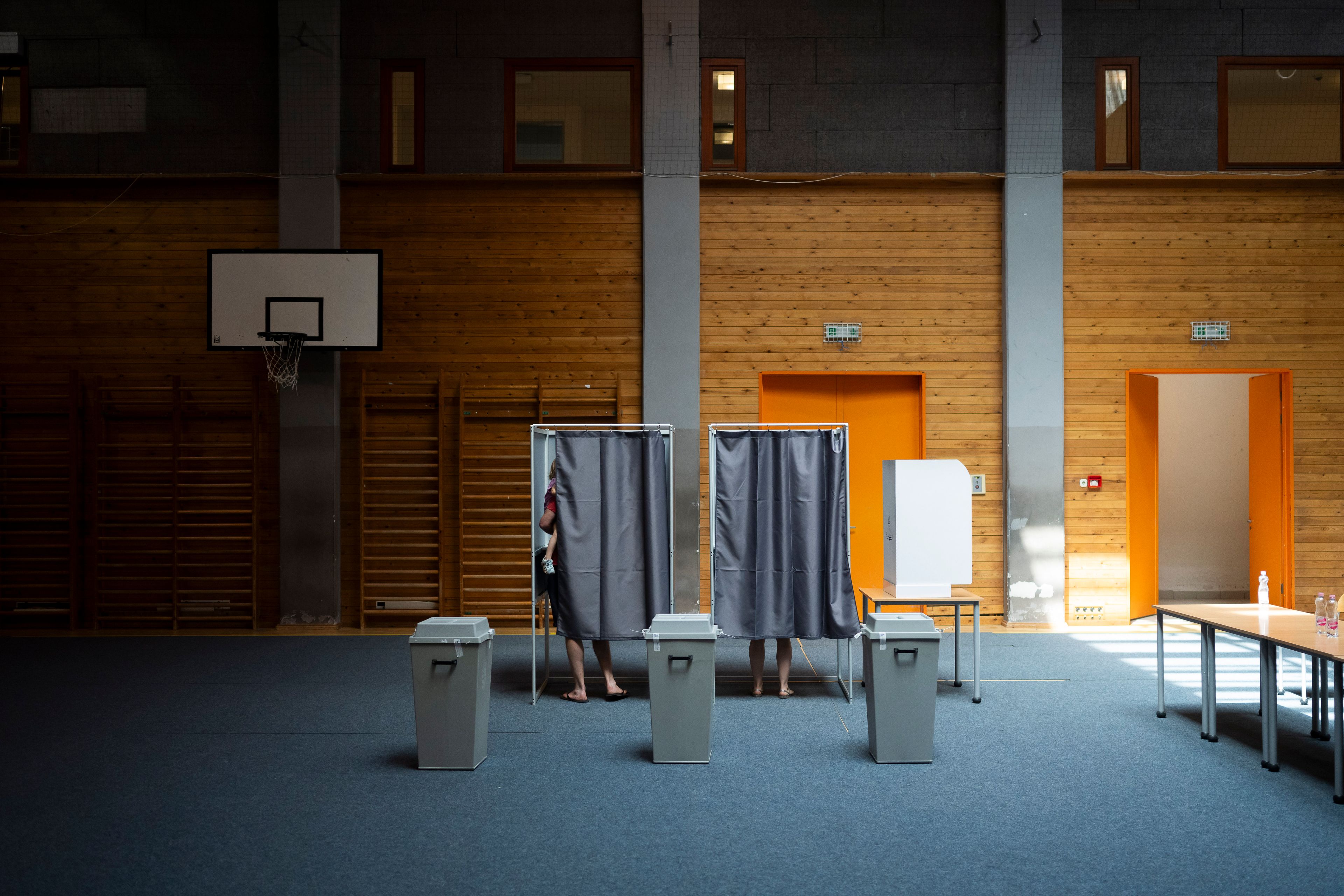 People vote at a polling station during the European Parliamentary elections, in Budapest, Hungary, Sunday, June 9, 2024.