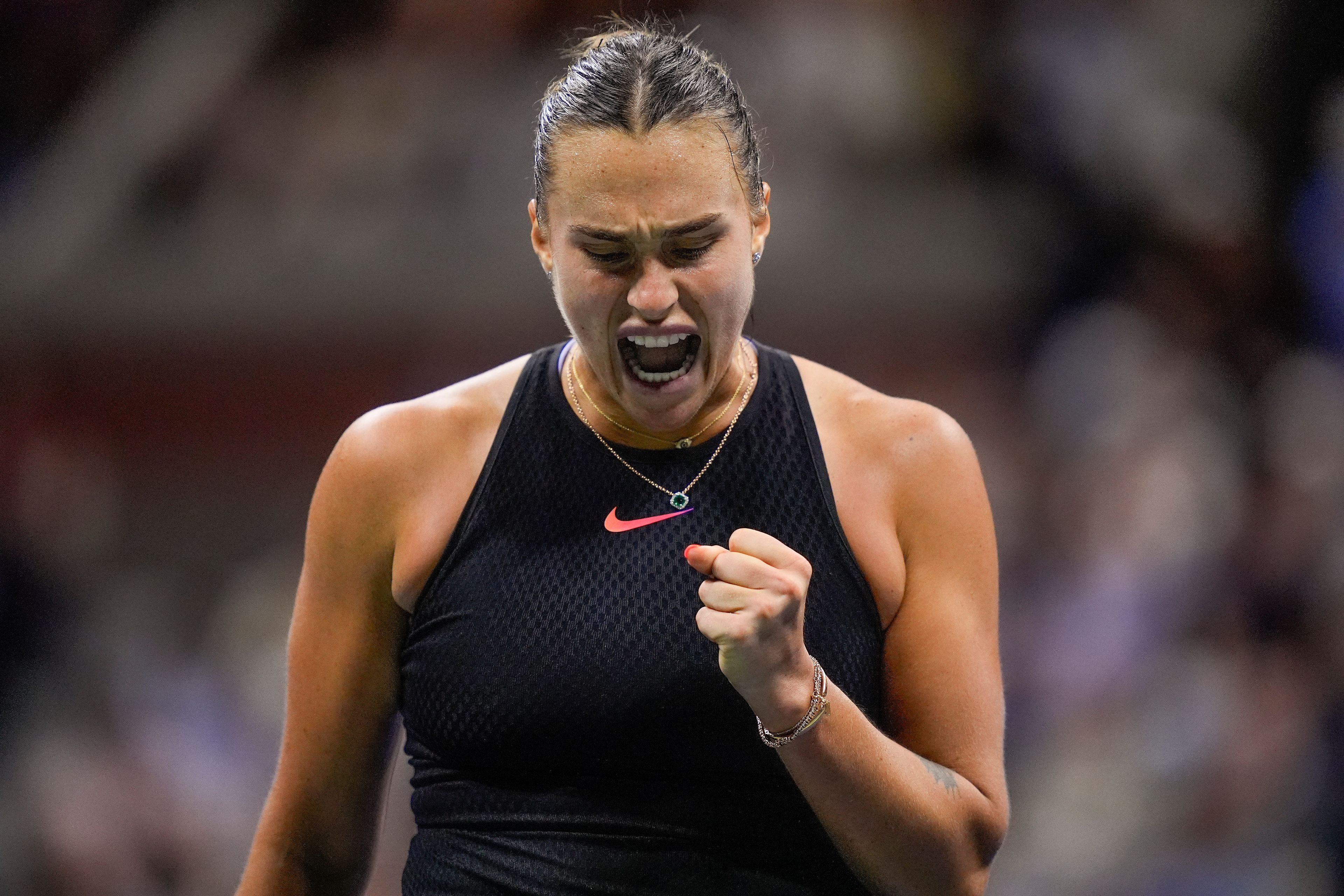 Aryna Sabalenka, of Belarus, reacts after scoring a point against Emma Navarro, of the United States, during the women's singles semifinals of the U.S. Open tennis championships, Thursday, Sept. 5, 2024, in New York.