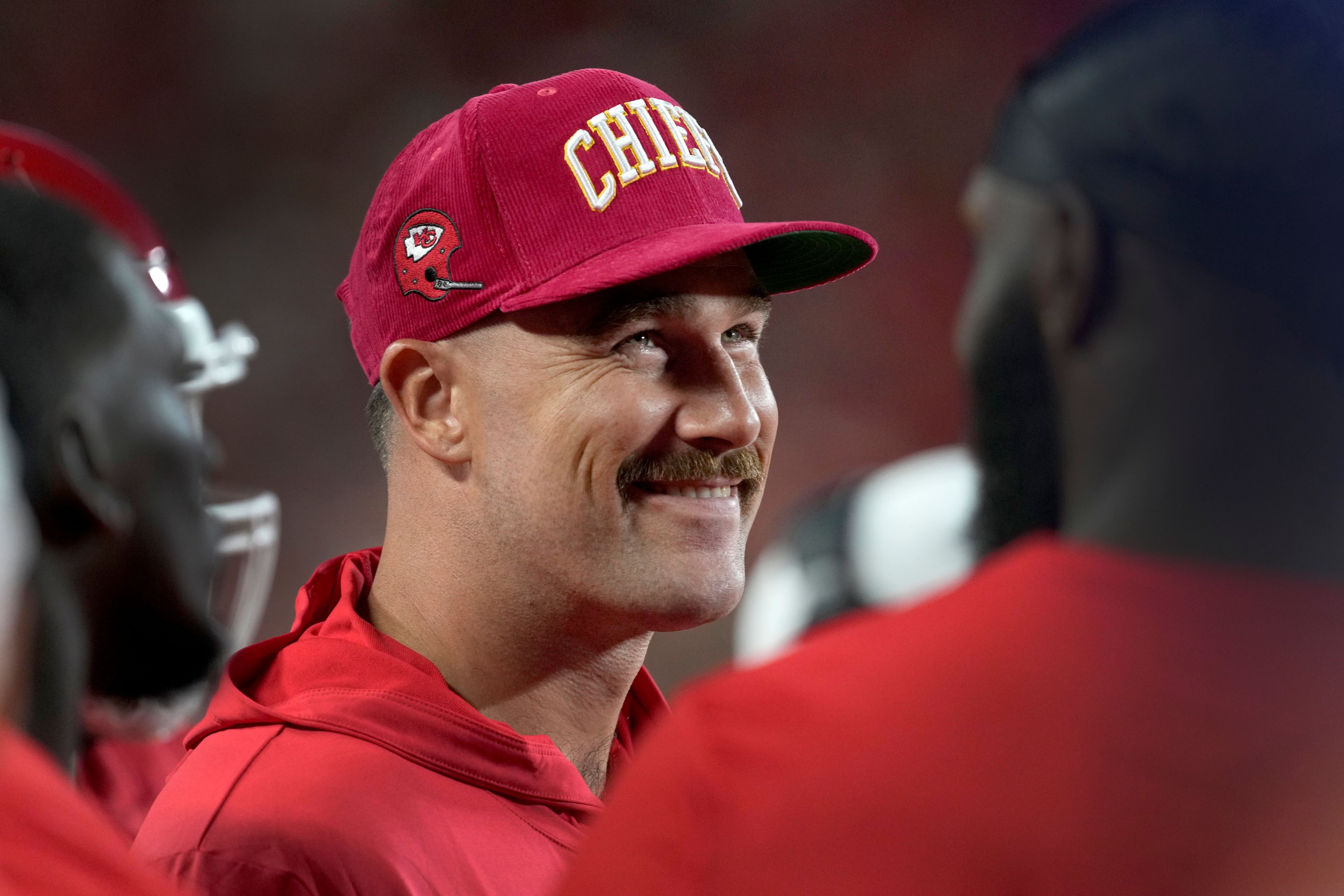 Kansas City Chiefs tight end Travis Kelce smiles on the sidelines during the first half of an NFL preseason football game against the Chicago Bears Thursday, Aug. 22, 2024, in Kansas City, Mo.