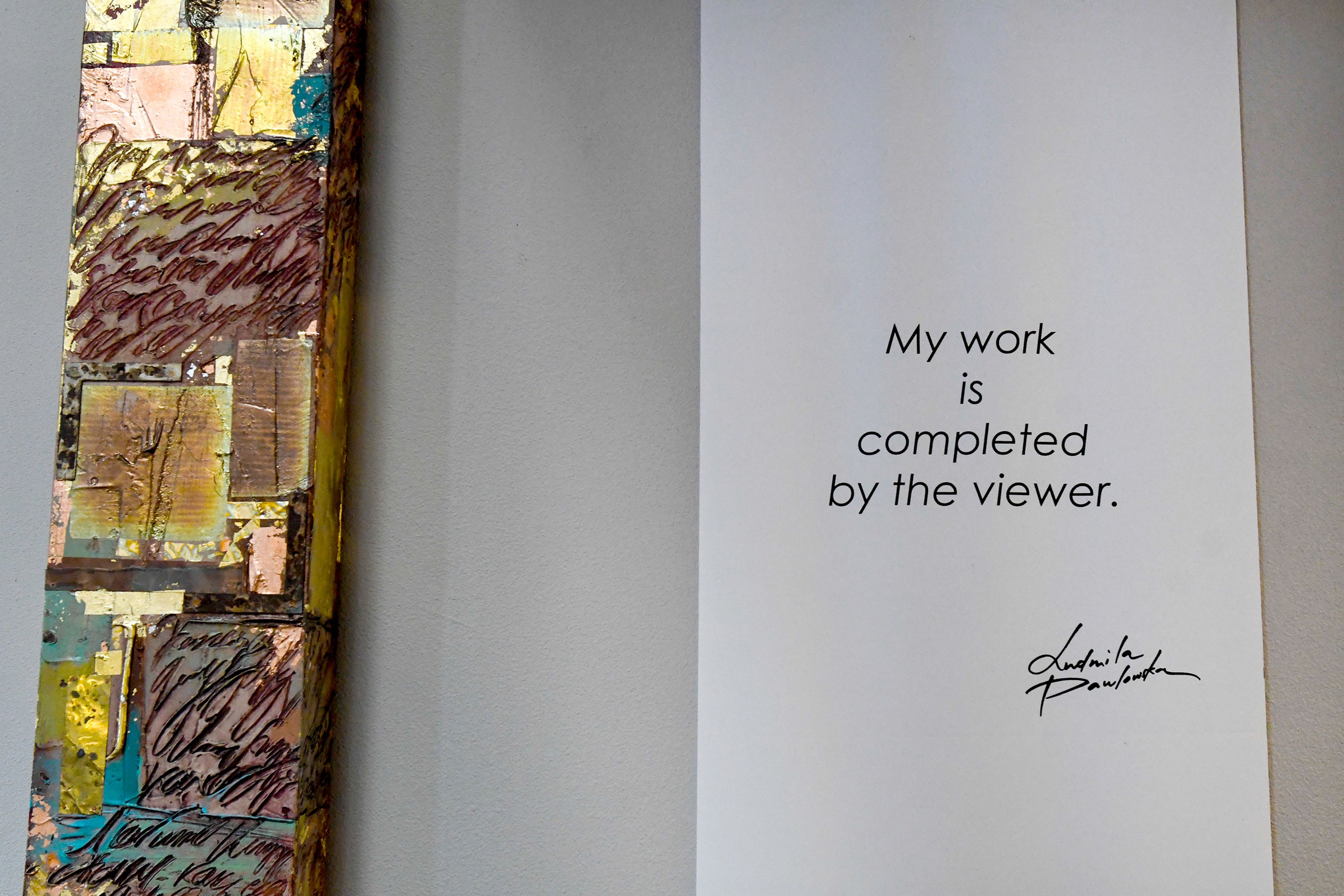 A statement from abstract expressionist Ludmila Pawlowska hangs Thursday next to a piece in her traveling exhibit, Icons in Transformation, at St. James Episcopal Church in Pullman.