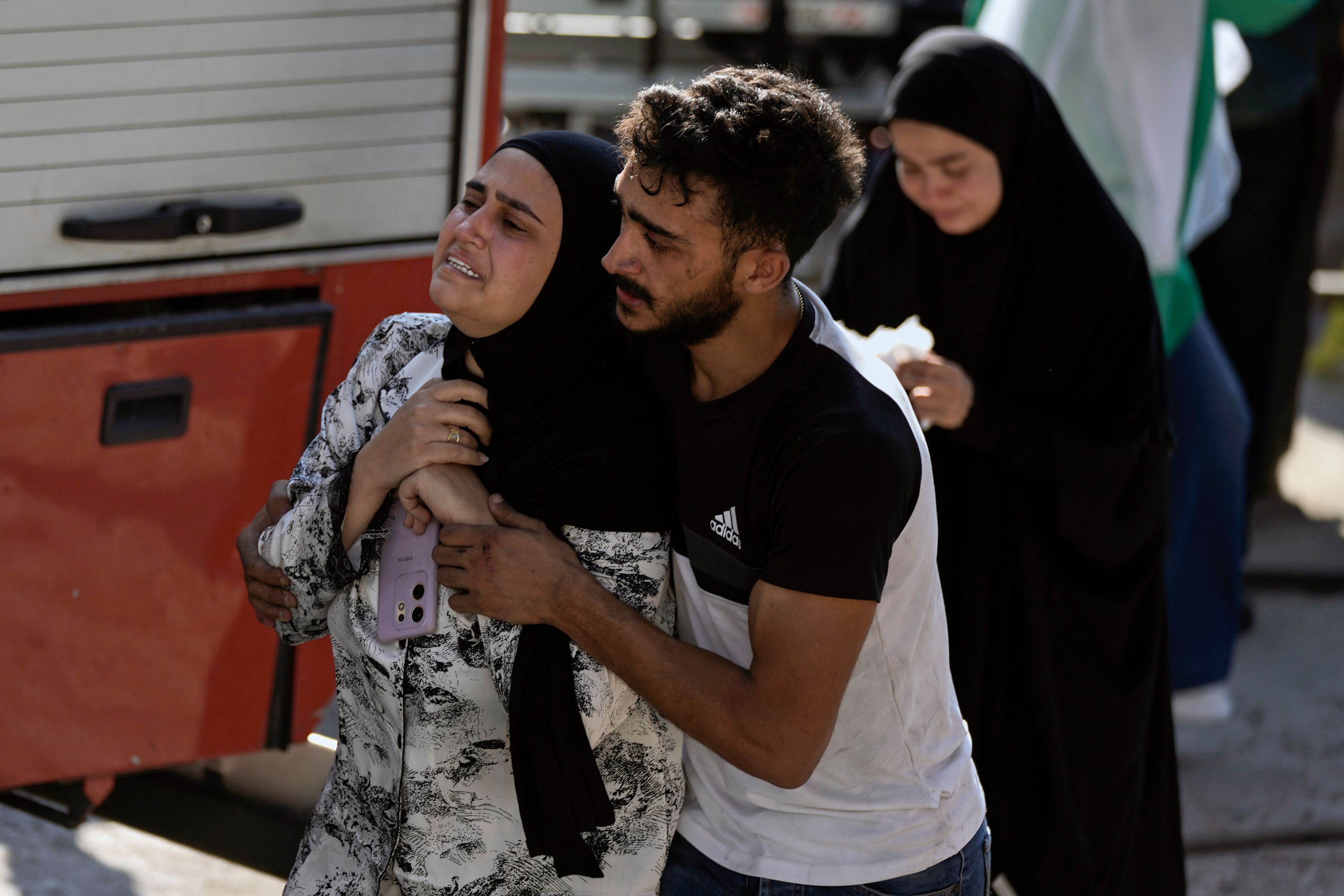 A woman reacts at the scene of an Israeli airstrike in the town of Maisara, north of Beirut, Wednesday, Sept. 25, 2024. (AP Photo/Bilal Hussein)