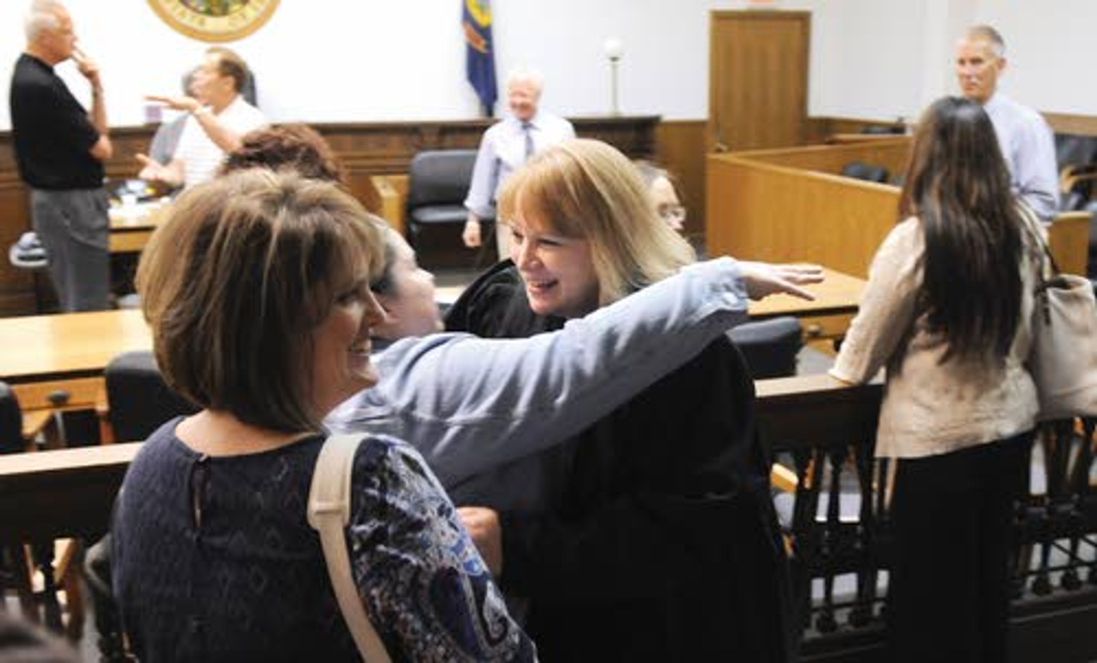 New Nez Perce County Magistrate Michelle Evans is greeted by former co-workers after being sworn in Friday at the Nez Perce County Courthouse in Lewiston.