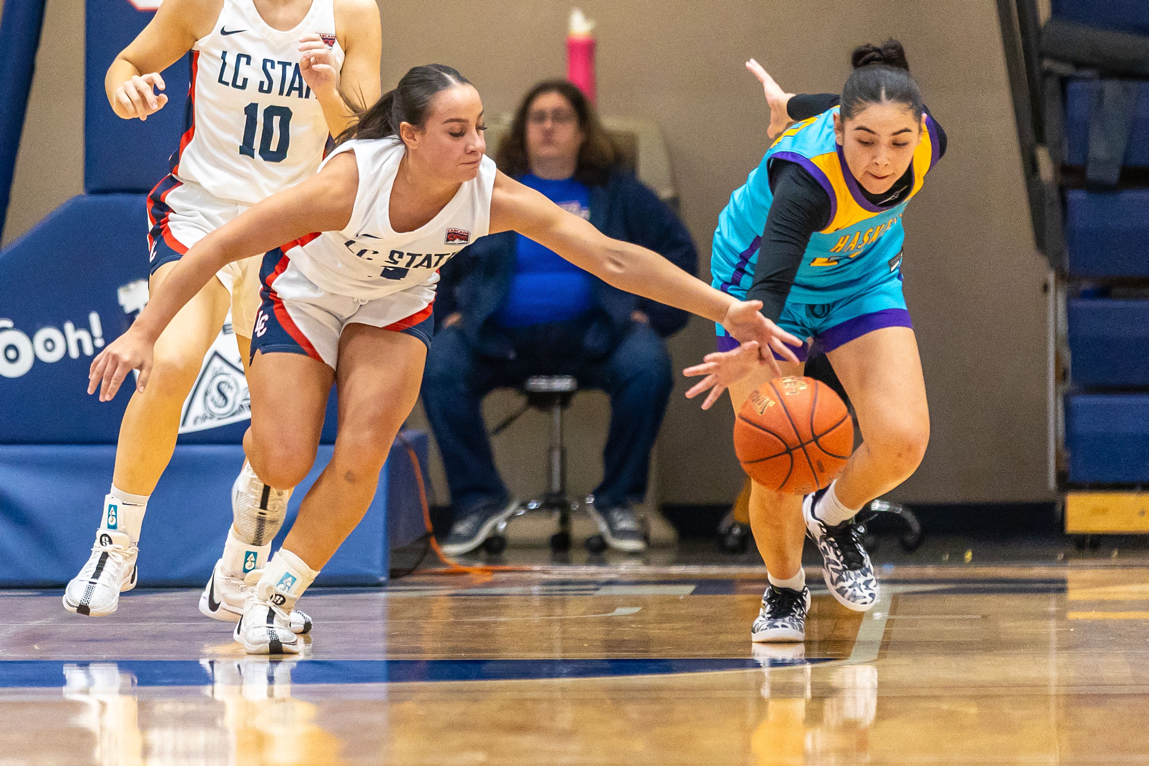 Lewis-Clark StateGuard Kendall Wallace fights for the rebound with Haskell guard Tierzah Penn during the season opening game as part of Tribal Nations Weekend Saturday in Lewiston.,