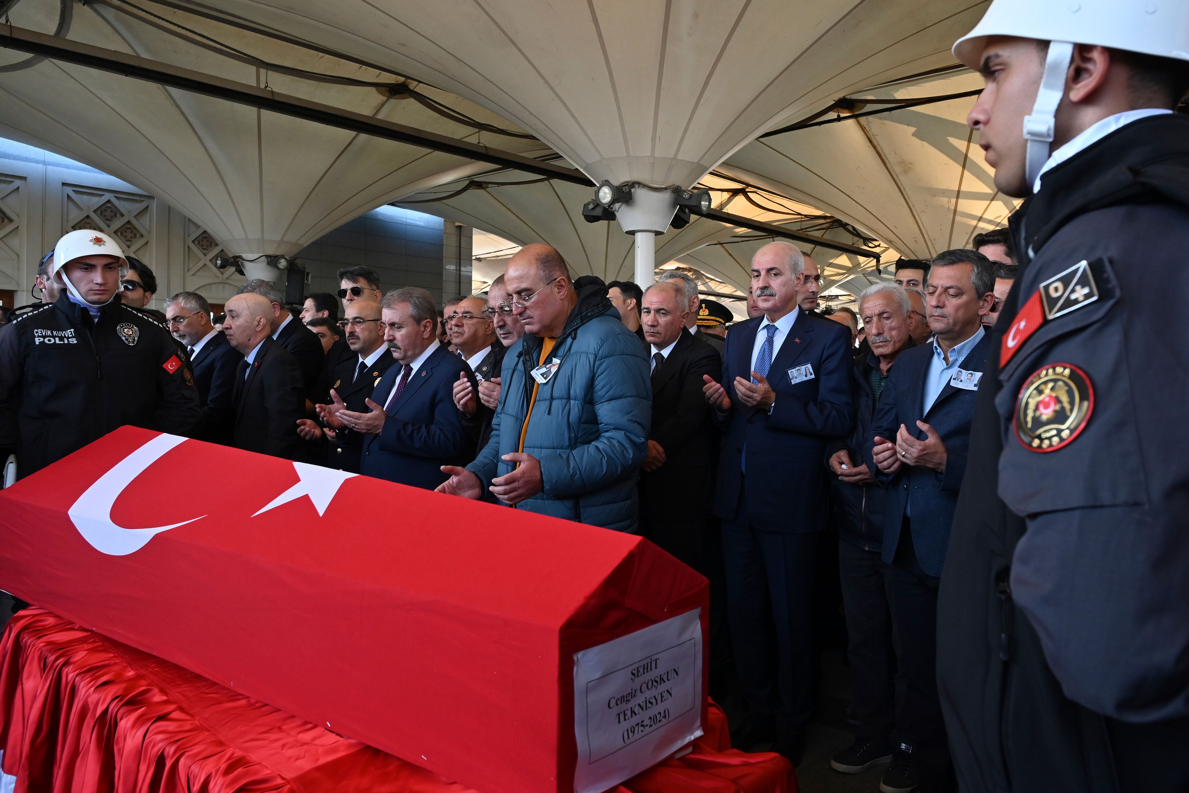 Relatives and authorities pray next to coffin of Cengiz Coskun, who was killed during an attack by PKK members at the Turkish aerospace and defense company TUSAS on Wednesday, during a funeral at Karsiyaka mosque in Ankara, Thursday, Oct. 24, 2024. (AP Photo/Ali Unal)