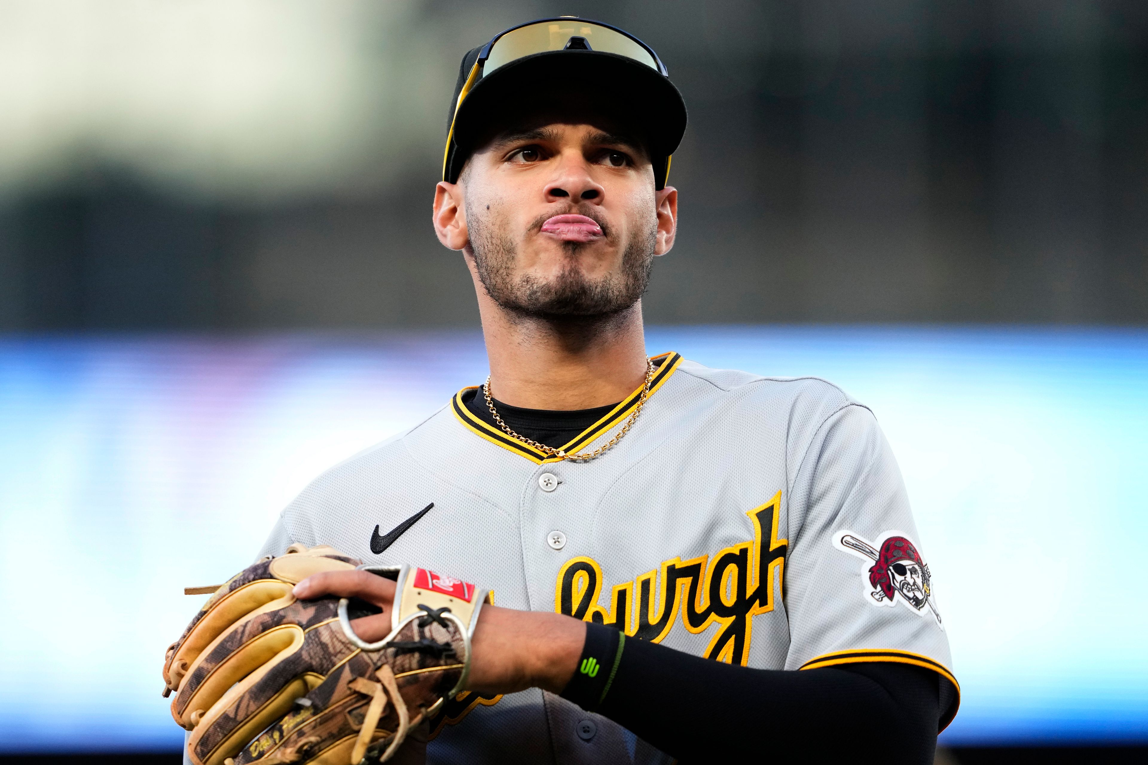 FILE - Pittsburgh Pirates' Tucupita Marcano jogs off the field against the Seattle Mariners in a baseball game, Friday, May 26, 2023, in Seattle. Major League Baseball has permanently banned Marcano Tuesday, June 4, 2024, for betting on baseball and suspended the four other players for one year after finding the players placed unrelated bets with a legal sportsbook.