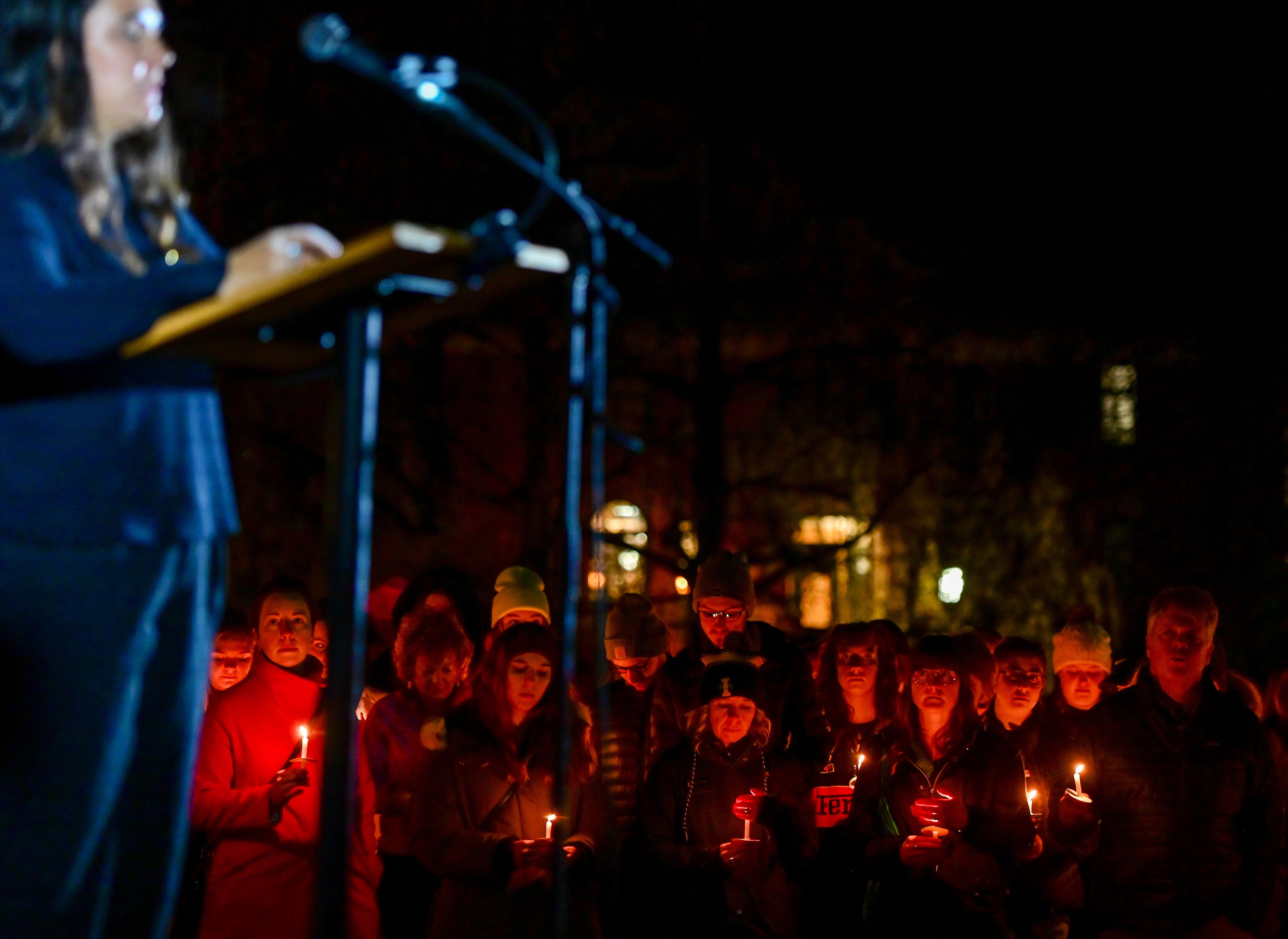 Students, staff and community members gather for a vigil in memory of the four University of Idaho students killed a year ago in a quadruple homicide in Moscow. Heather Blaschka, left, speaks fondly of the memories shared with friend Madison Mogen, one of the four killed, during the vigil on campus Monday.