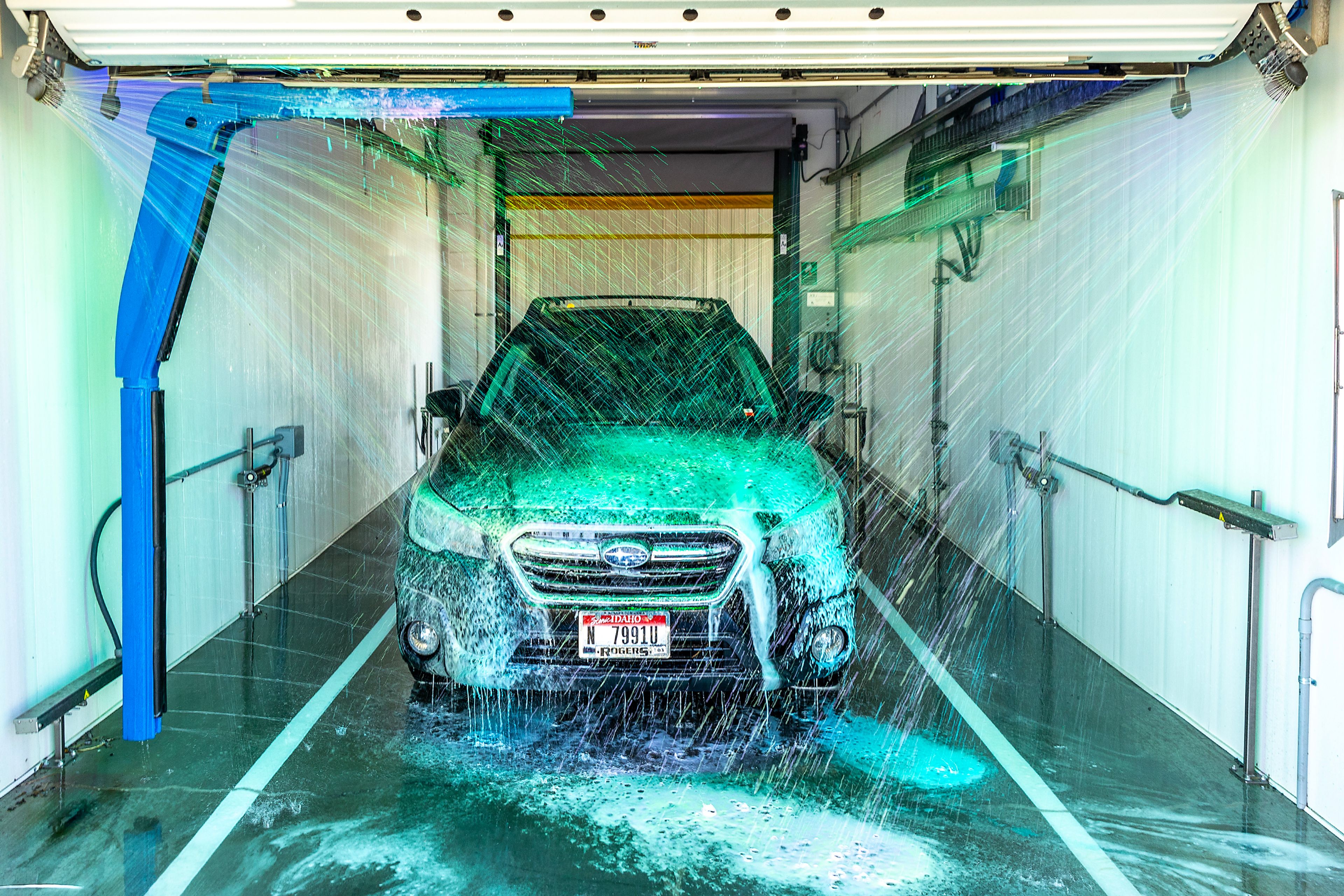 A car is sprayed down while going through a wash at Adele�s Express Auto Wash. 