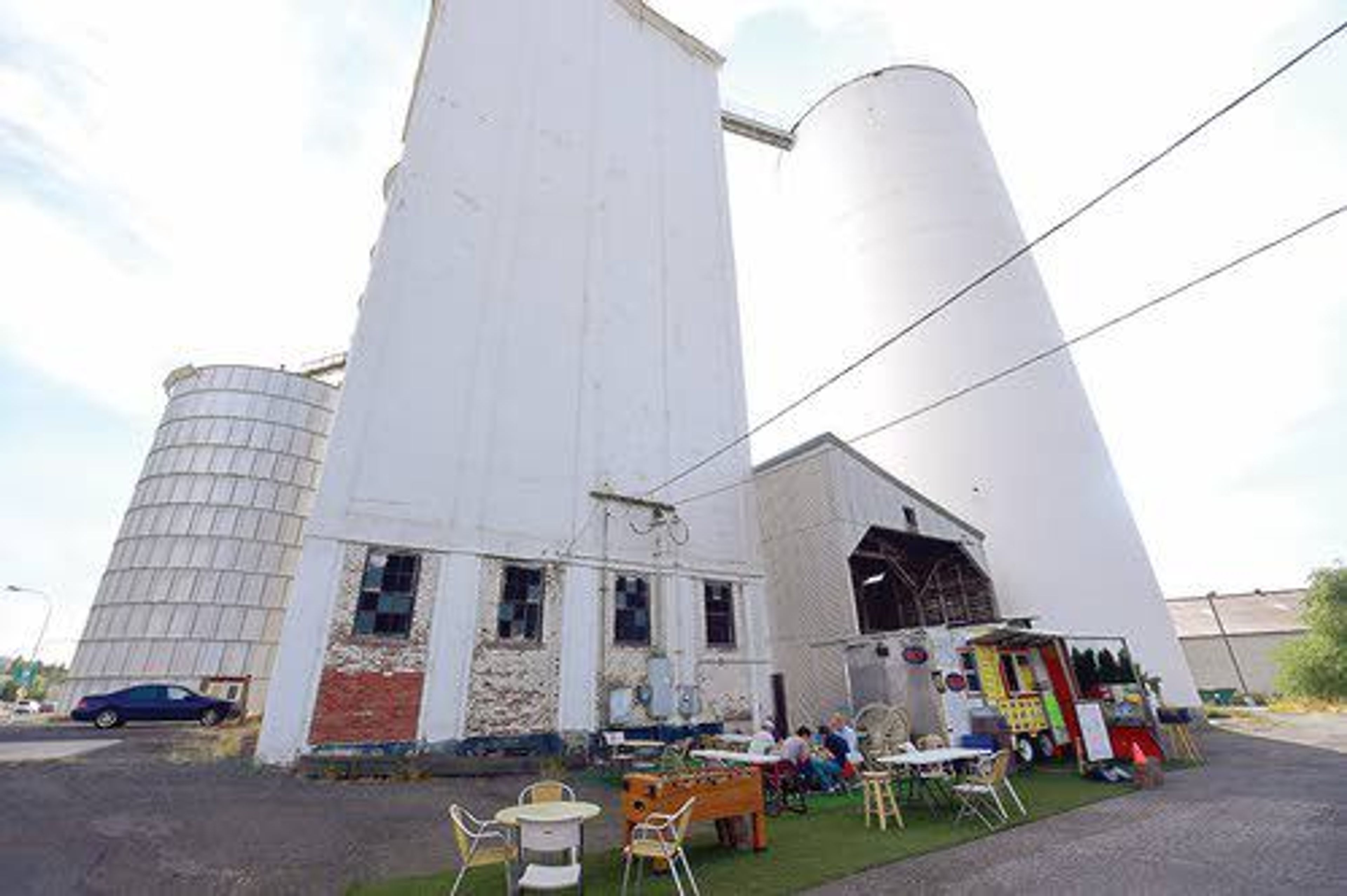 People eat at a taco stand that is leasing space at the Jackson Street grain elevators in Moscow.