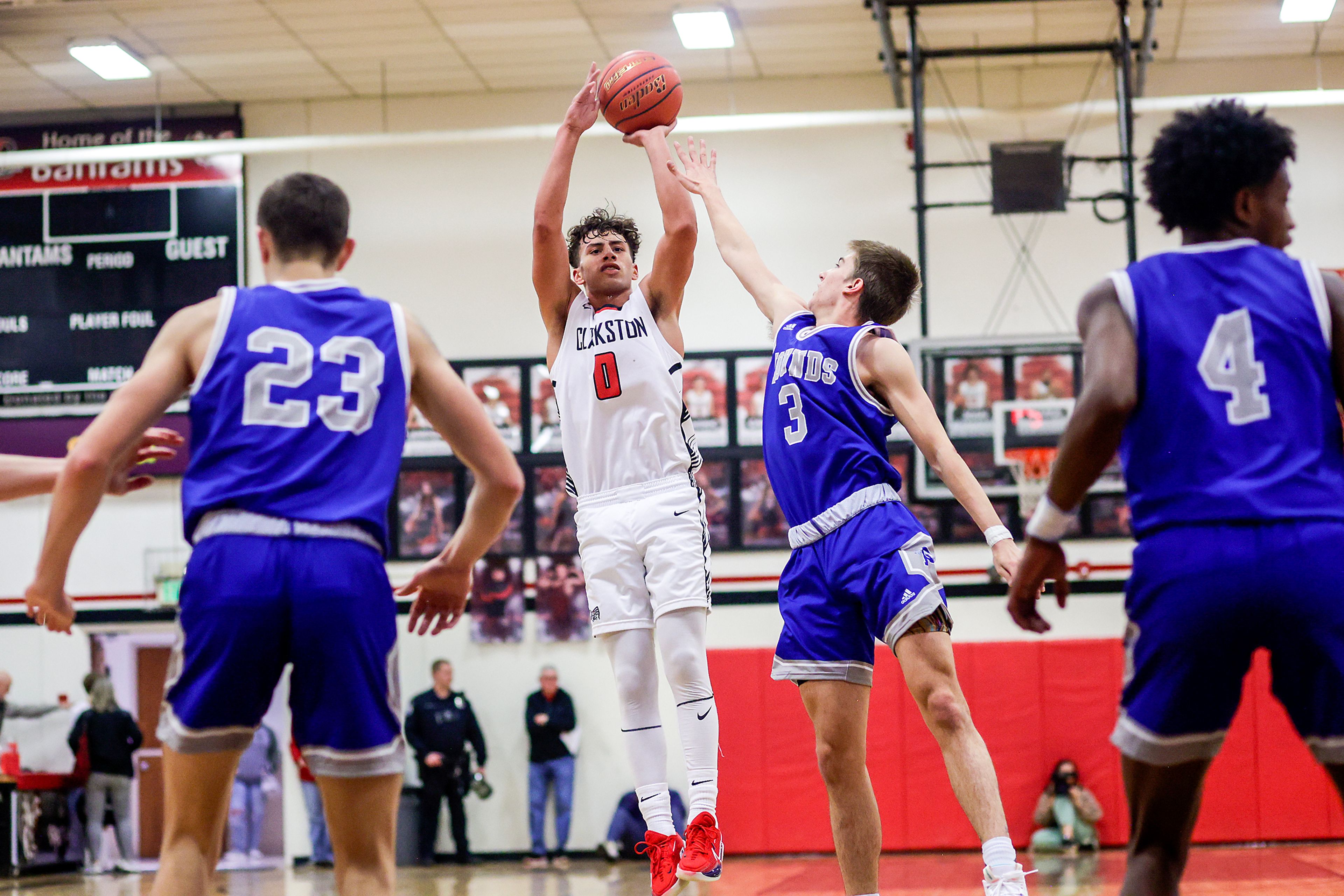 Clarkston guard Xavier Santana, center, shoots a 3-pointer during Tuesday's Class 2A Greater Spokane League boys basketball game against Pullman.