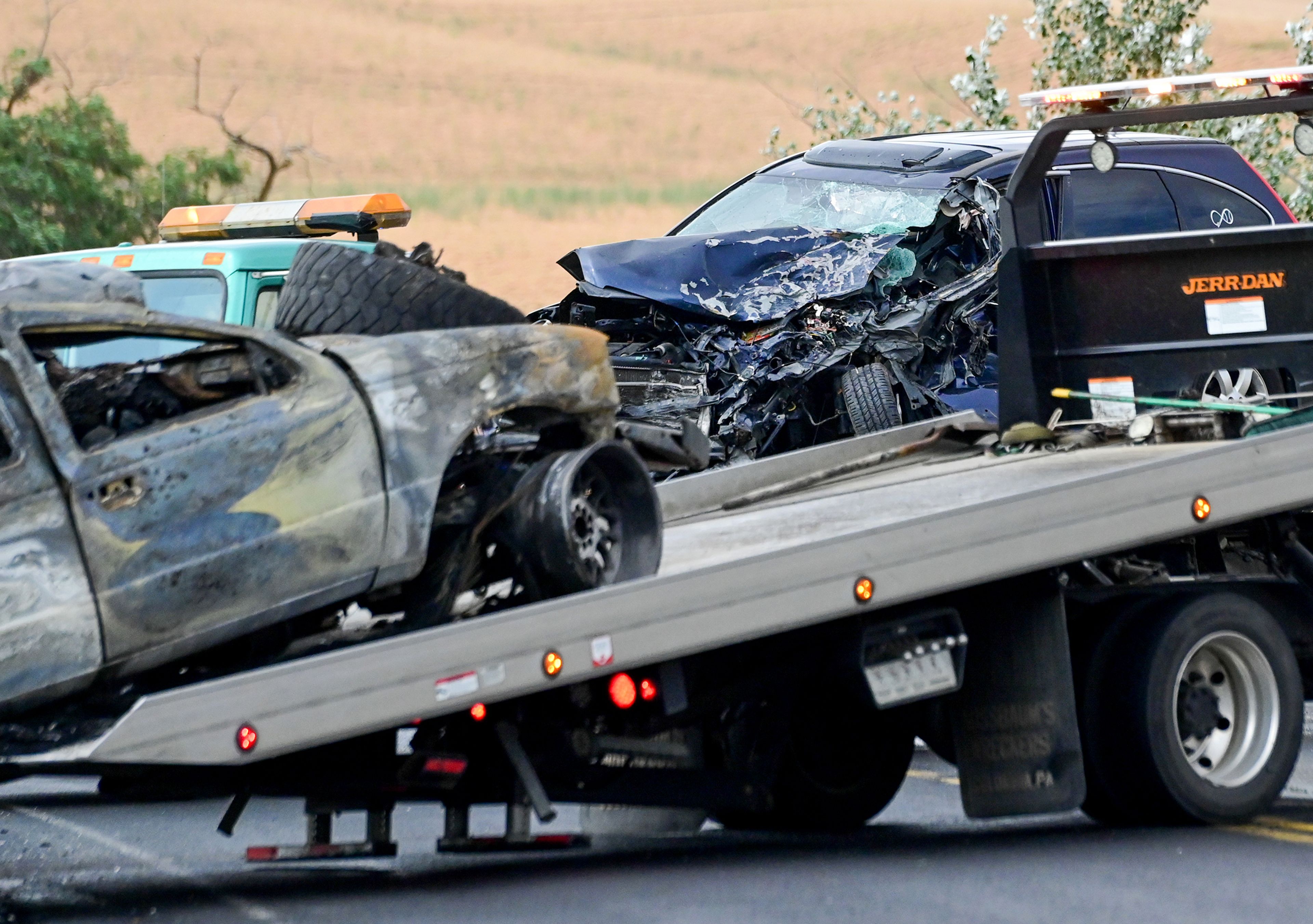 A truck gets pulled away following a crash on US Highway 95 south of Moscow on Monday.