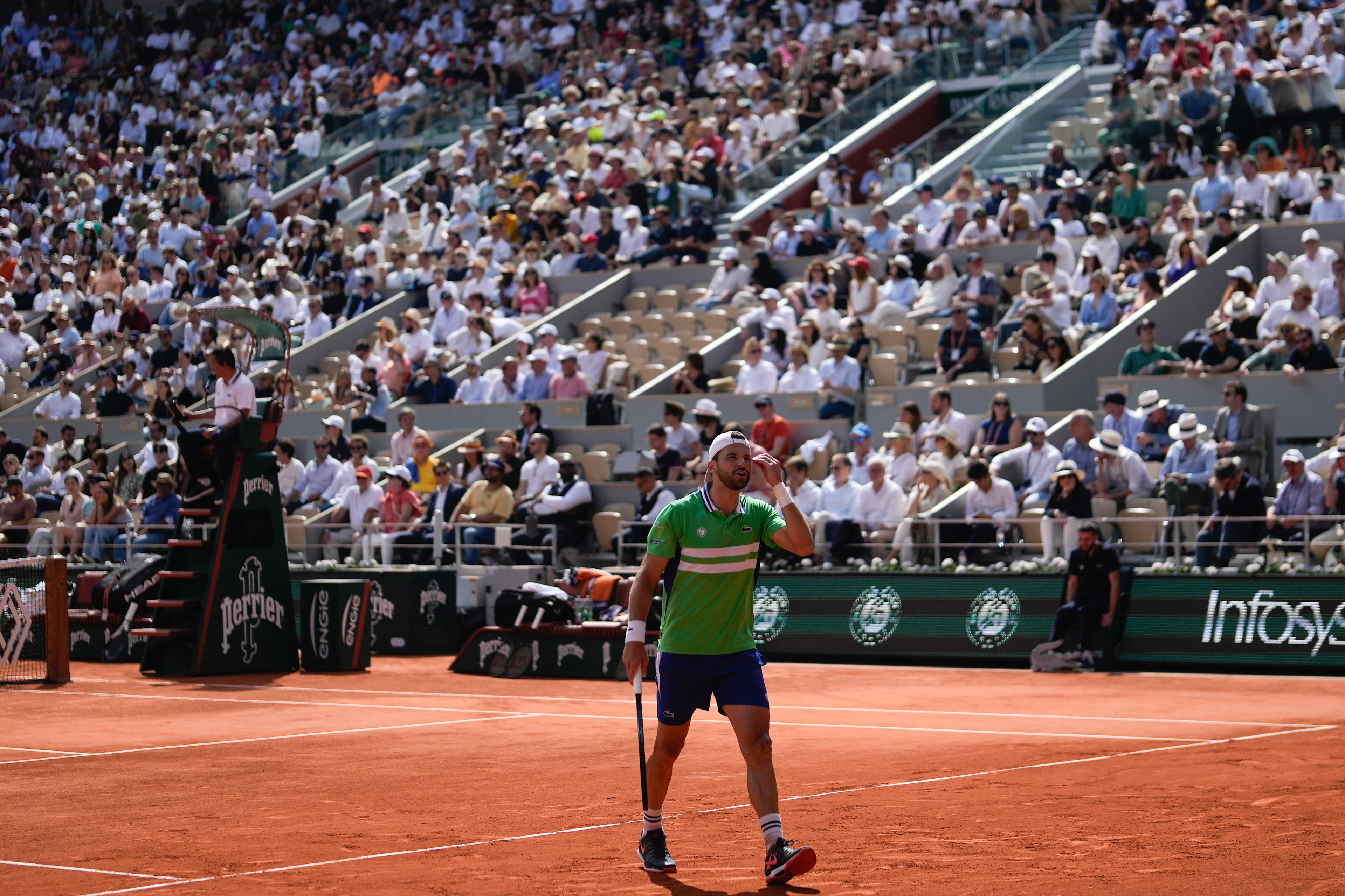 Bulgaria's Grigor Dimitrov reacts after missing a shot against Italy's Jannik Sinner during their quarterfinal match of the French Open tennis tournament at the Roland Garros stadium in Paris, Tuesday, June 4, 2024.