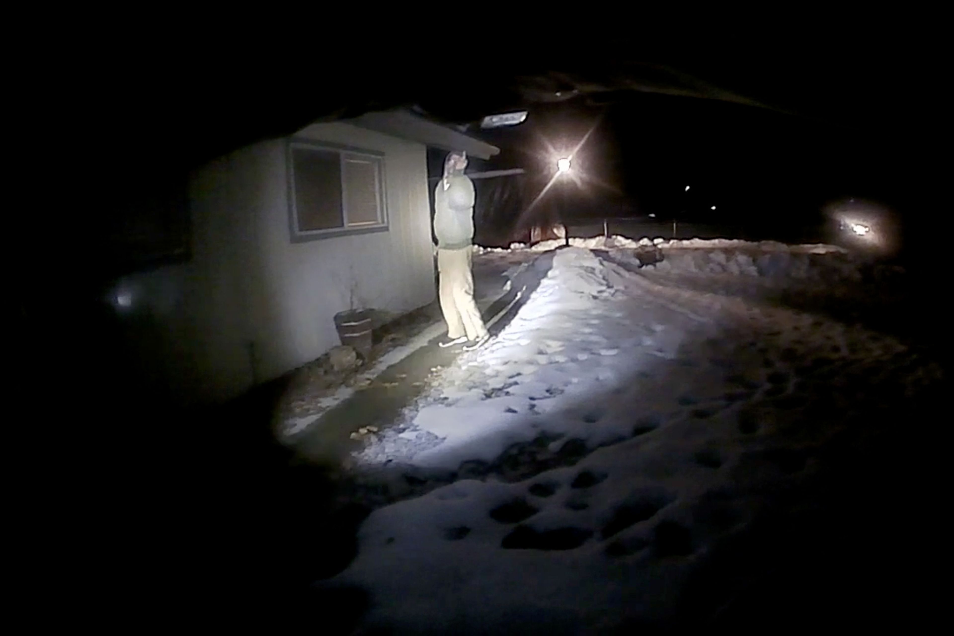 Michael J. Trappett gestures toward Clearwater County Sheriff's Office deputies in this image taken from an officer's body camera footage. Moments after this image, Trappett was shot and killed by the officers after turning toward them with the knife held up in his right hand.