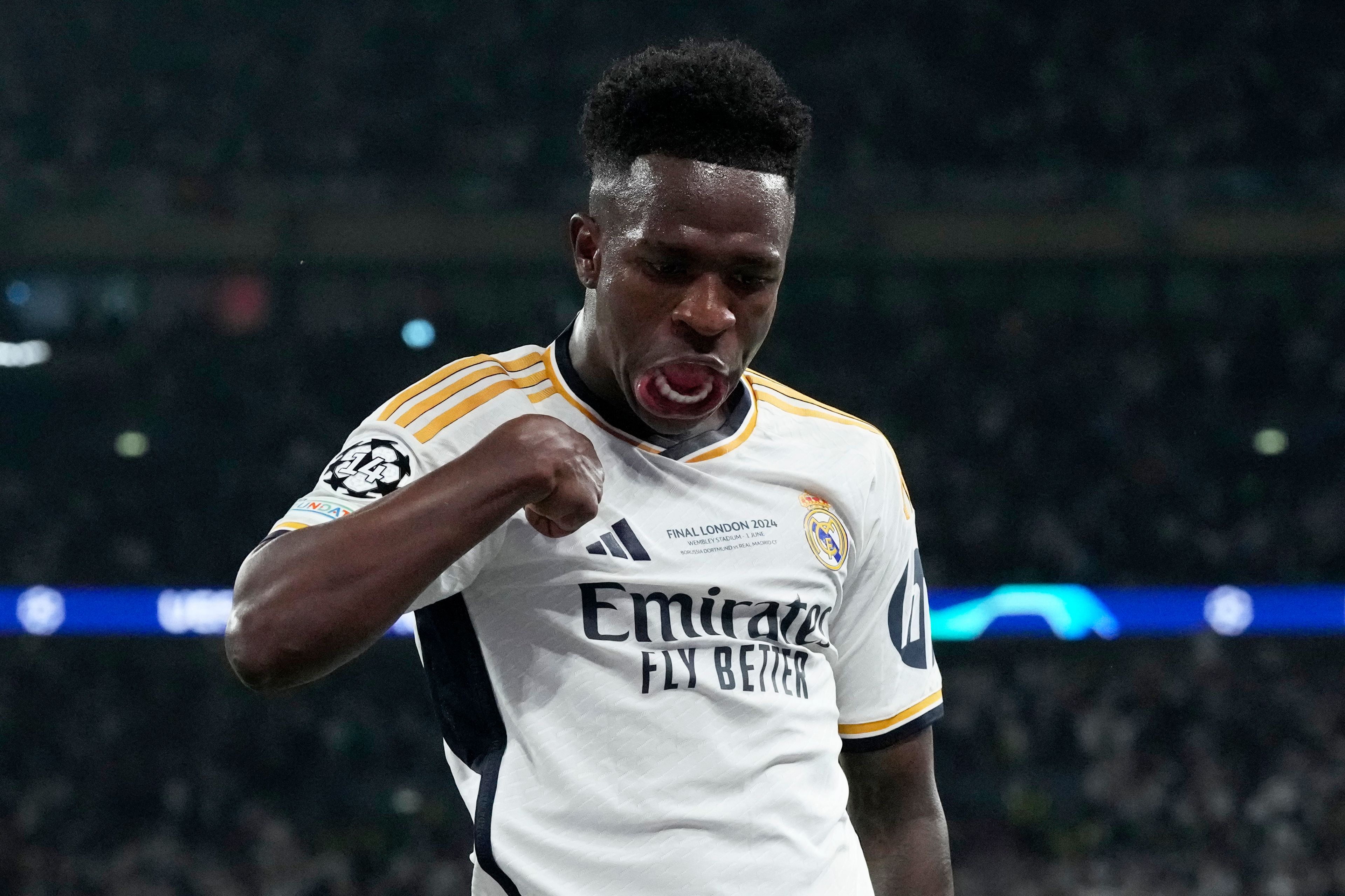 Real Madrid's Vinicius Junior celebrates after scoring his side's second goal during the Champions League final soccer match between Borussia Dortmund and Real Madrid at Wembley stadium in London, Sunday, June 2, 2024.