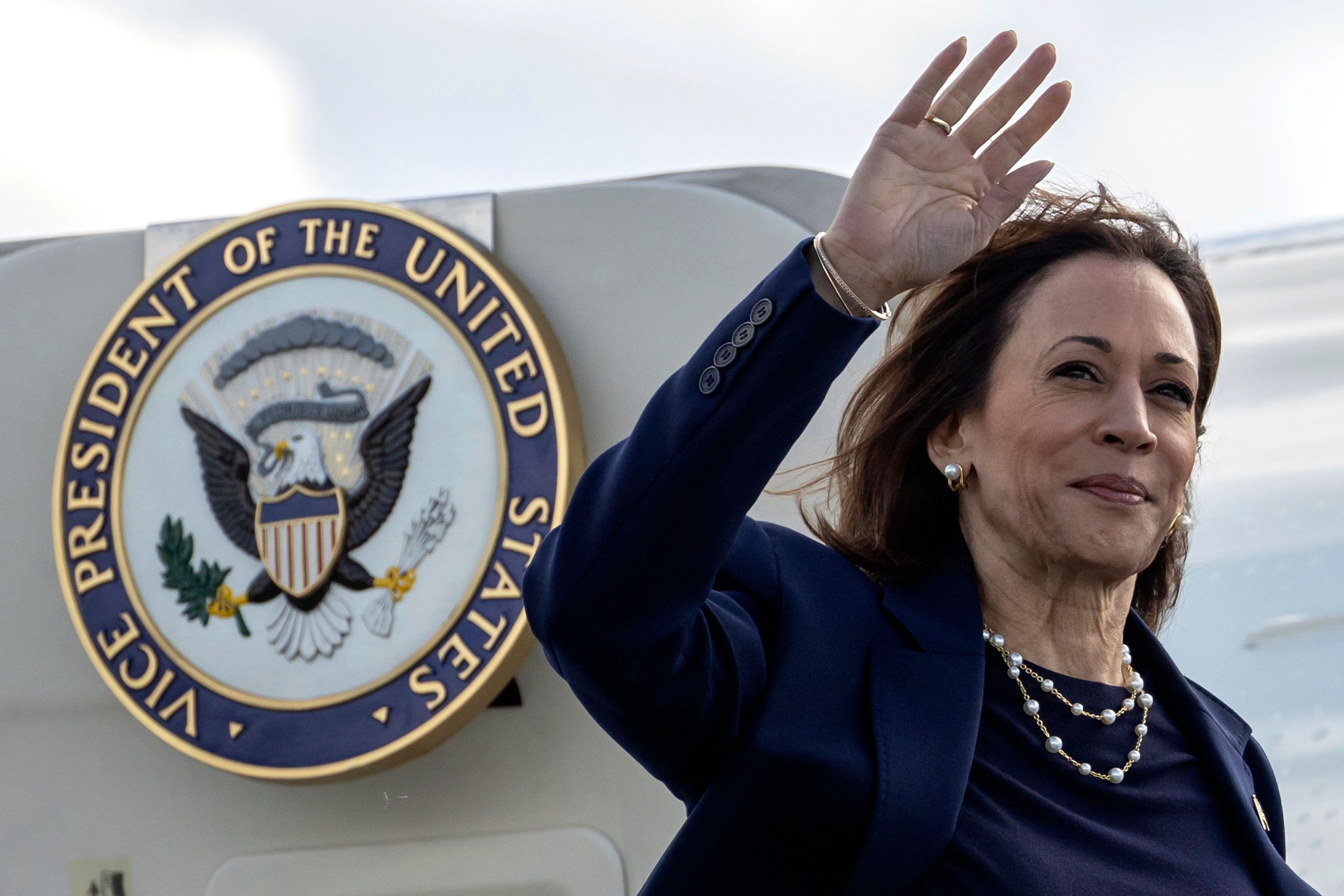 Democratic presidential nominee Vice President Kamala Harris waves as she boards Air Force Two at LaGuardia International Airport, Wednesday, Oct. 9, 2024, in New York. (AP Photo/Yuki Iwamura)