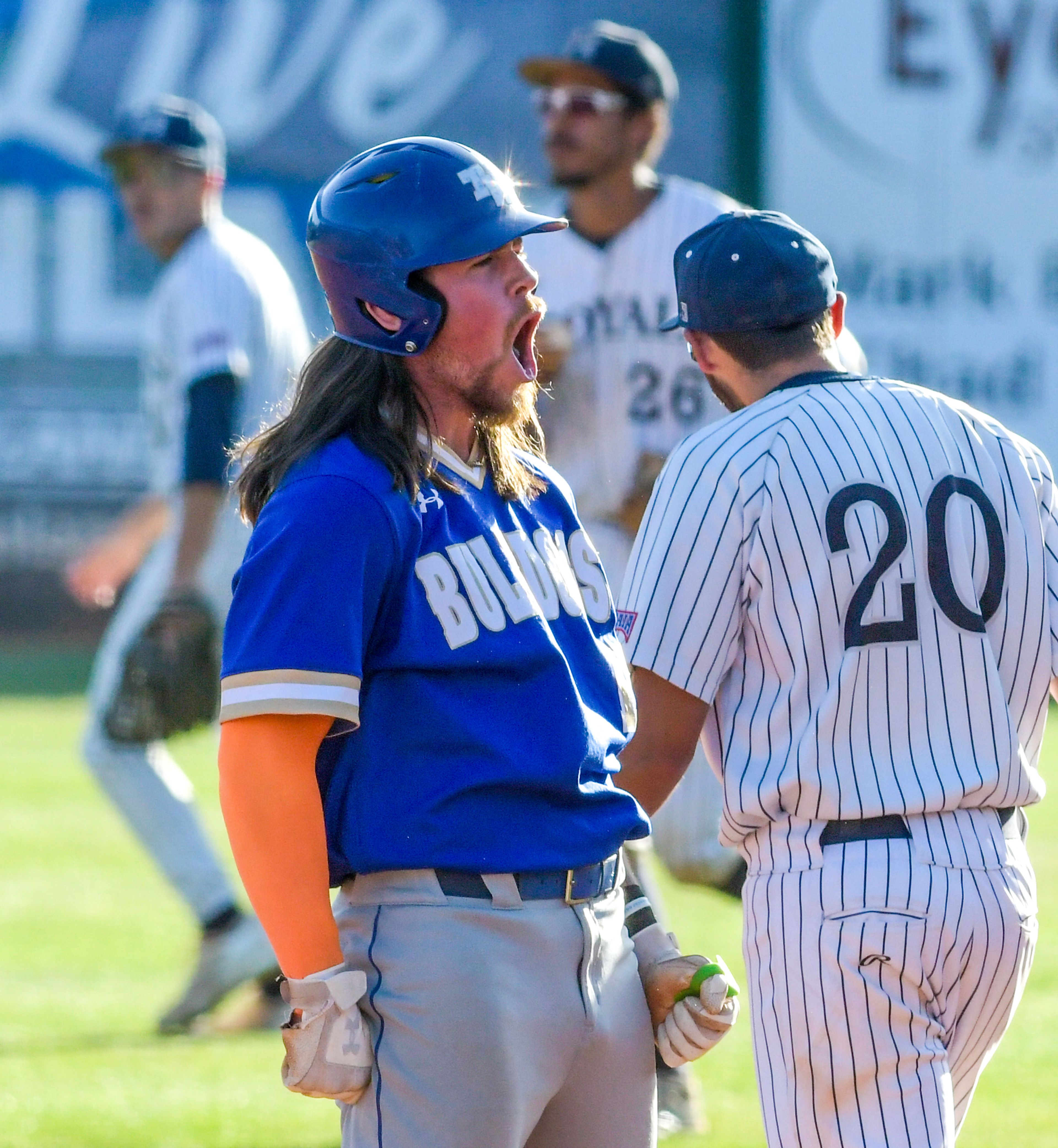 Tennessee Wesleyan’s Evan Magill lets out a yell as he makes it onto first base against Hope International in Game 19 of the NAIA World Series at Harris Field Friday in Lewiston.