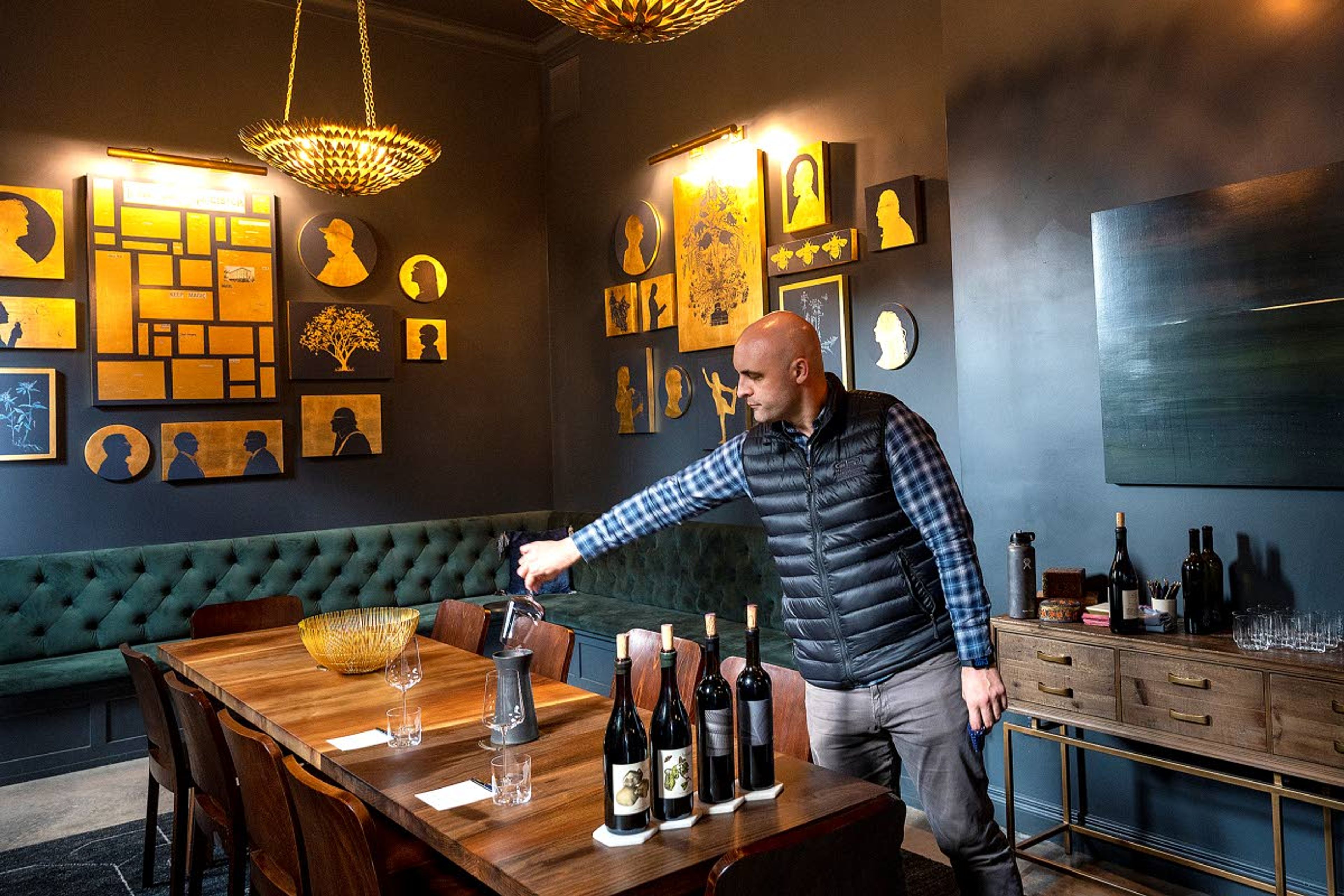 Andrew Dirks, a sommelier with Antica Terra & Lillian, prepares an exclusive wine tasting for a small group of visitors to the Atticus Hotel in downtown McMinnville.