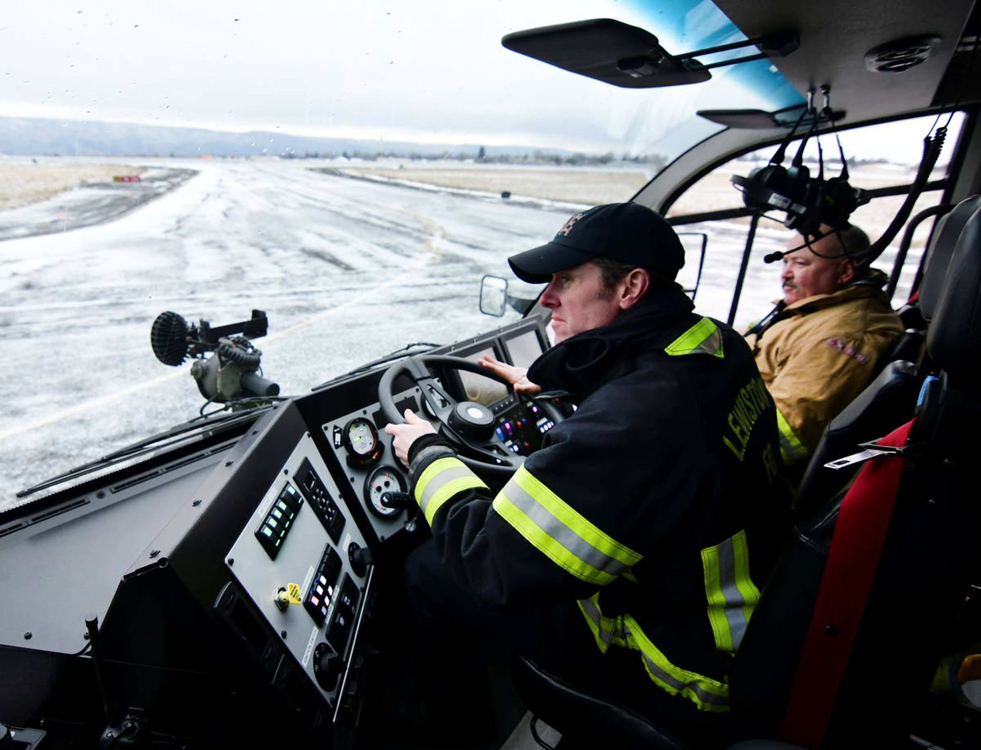 Lewiston Fire Department Engineer Gavin Triplett drives the new airport rescue and firefighting truck for the first time Tuesday, taking turns with other firefighters for their first look.