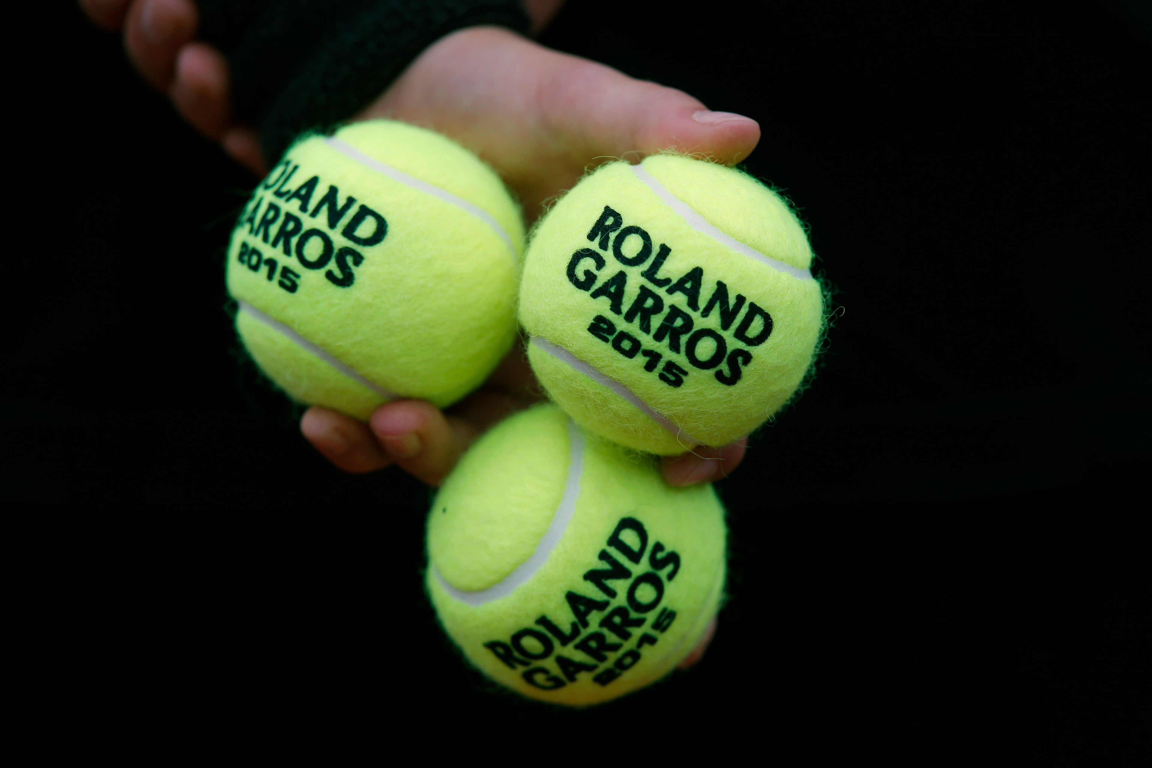 FILE - A ball boy holds tennis balls during the first round matches of the French Open tennis tournament against at Roland Garros stadium, in Paris, France, Tuesday, May 26, 2015. The 2024 French Open begins Sunday, May 26.