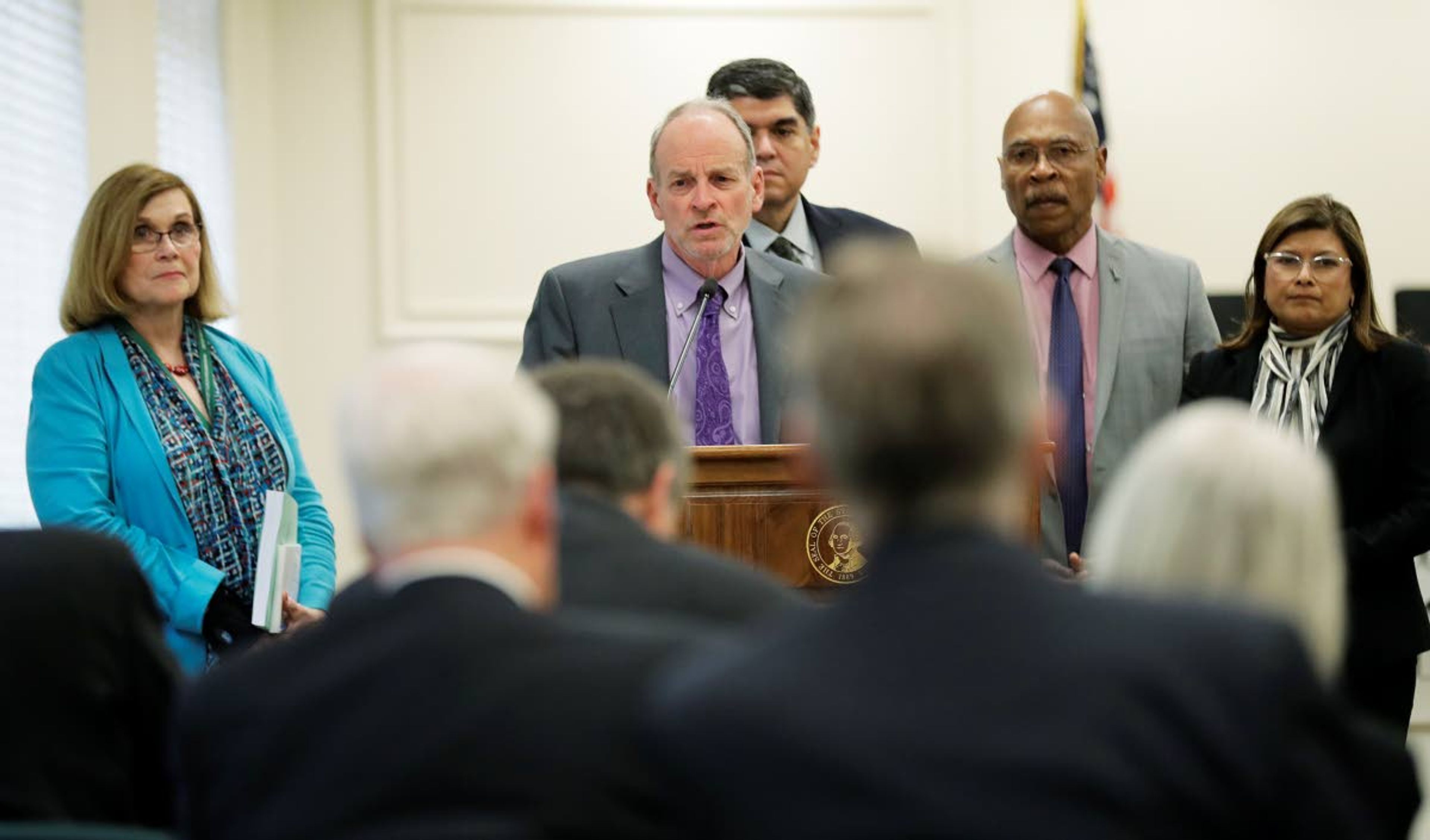 Rep. Jake Fey, D-Tacoma, center, chairman of the House Transportation Committee, talks to reporters, Monday, March 25, 2019 at the Capitol in Olympia, Wash. Democrats in the Washington House released their two-year transportation budget proposal Monday, which includes $9.9 billion in spending for projects. (AP Photo/Ted S. Warren)