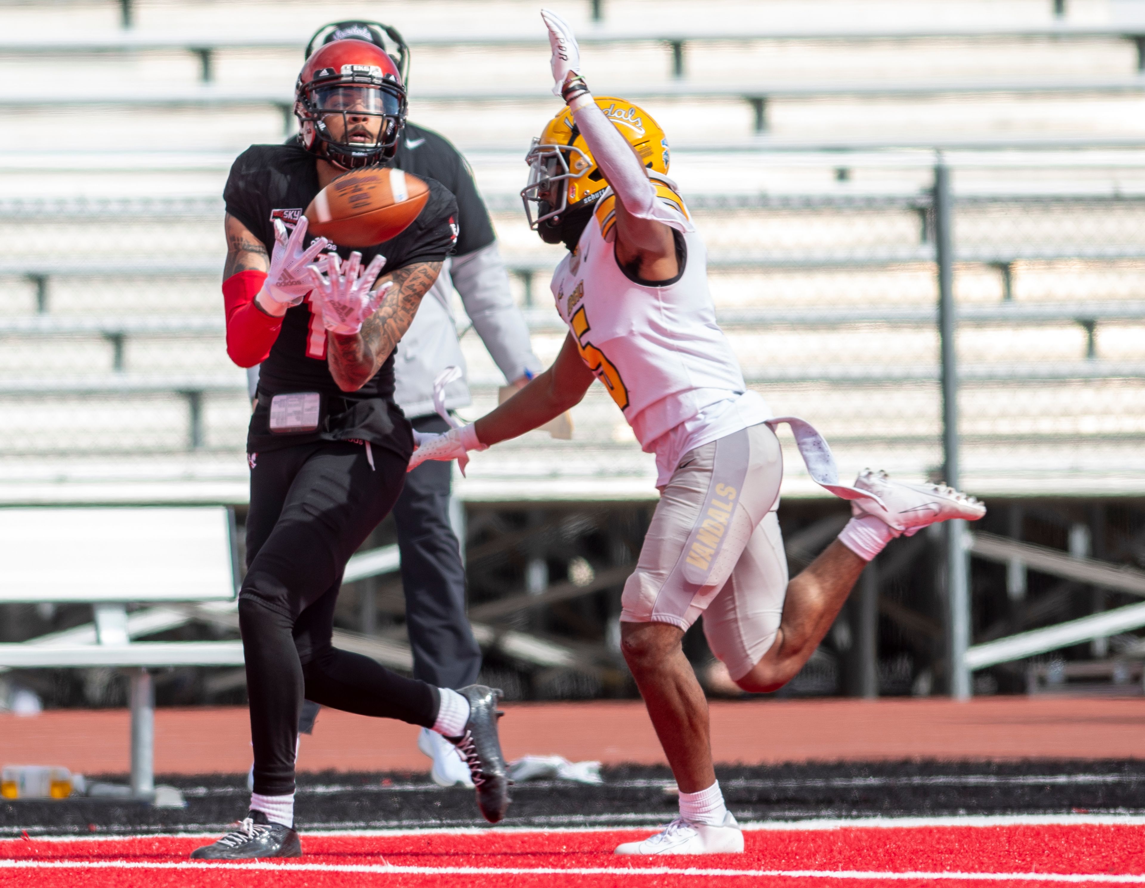 Idaho defensive back Dareon Nash (5) defends a pass attempt to Eastern Washington wide receiver Talolo Limu-Jones (1) during the third quarter of a Big Sky Conference matchup at Roos Field on Saturday afternoon. Eastern Washington defeated Idaho 38-31.