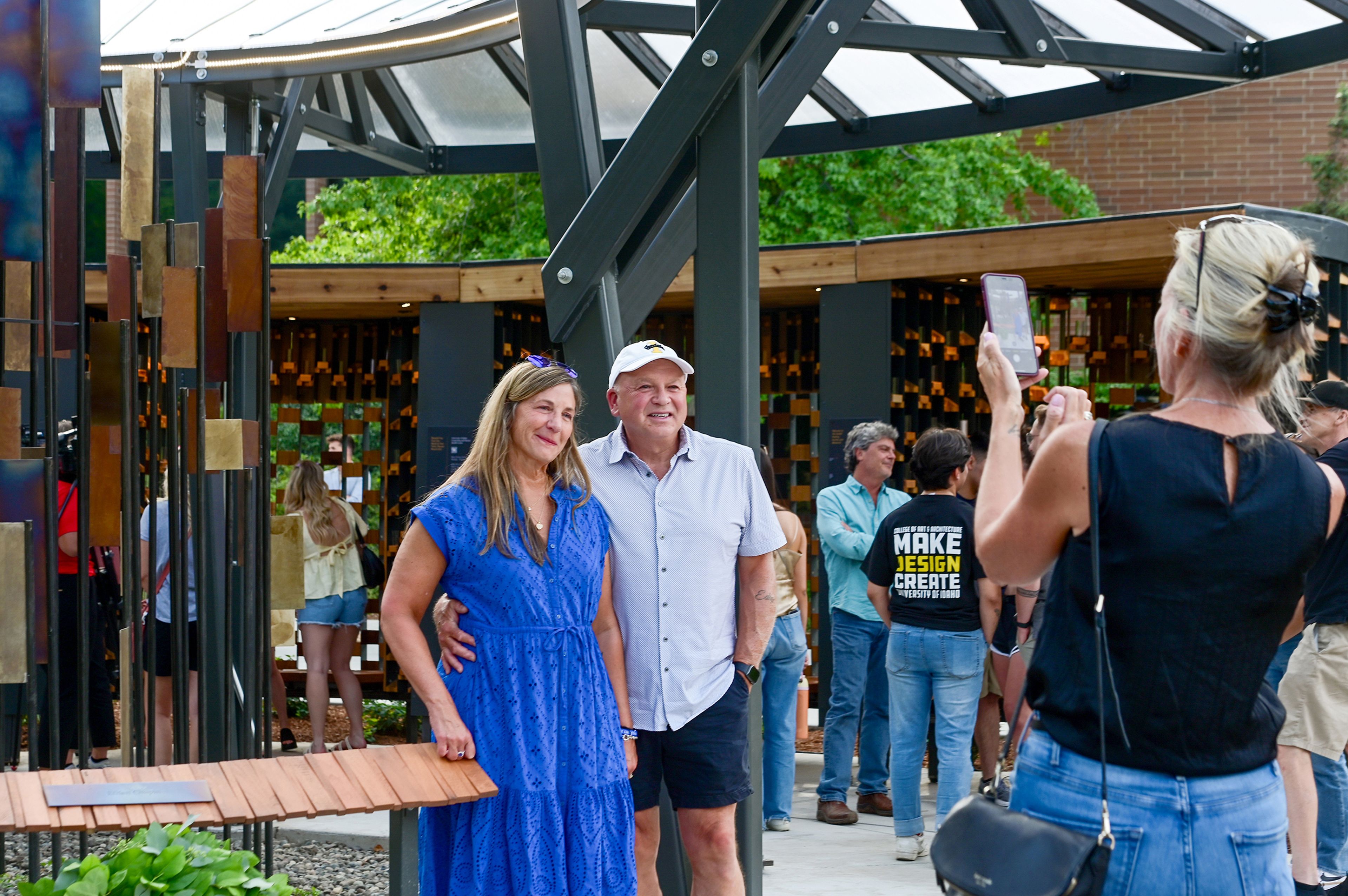 Stacy and Jim Chapin take a photo near a plaque engraved with their son Ethan Chapin’s name at the dedication ceremony for the Vandal Healing Garden and Memorial on Wednesday in Moscow. A memorial sculpture within the garden specifically memorializes Xana Kernodle, Ethan Chapin, Kaylee Goncalves and Maddie Mogen, the victims of the November 2022 homicide.